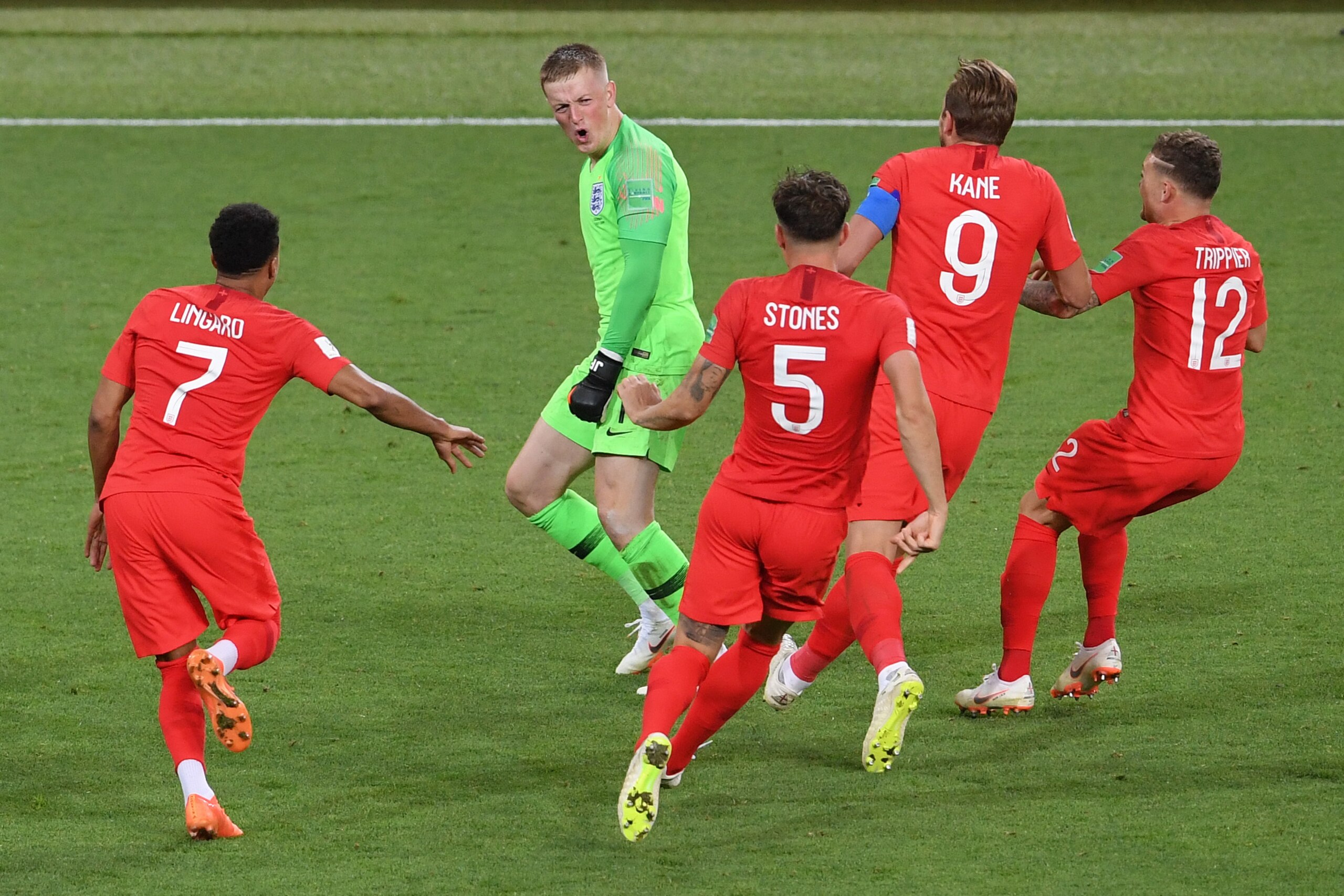 MOSCOW, RUSSIA - JULY 03:  Jordan Pickford of England is congratulated by Jesse Lingard, John Stones, Harry Kane and Kieran Trippier after victory during the 2018 FIFA World Cup Russia Round of 16 match between Colombia and England at Spartak Stadium on J