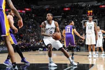 SAN ANTONIO, TX - APRIL 5: Kawhi Leonard #2 of the San Antonio Spurs handles the ball against the Los Angeles Lakers on April 5, 2017 at the AT&T Center in San Antonio, Texas. NOTE TO USER: User expressly acknowledges and agrees that, by downloading and o