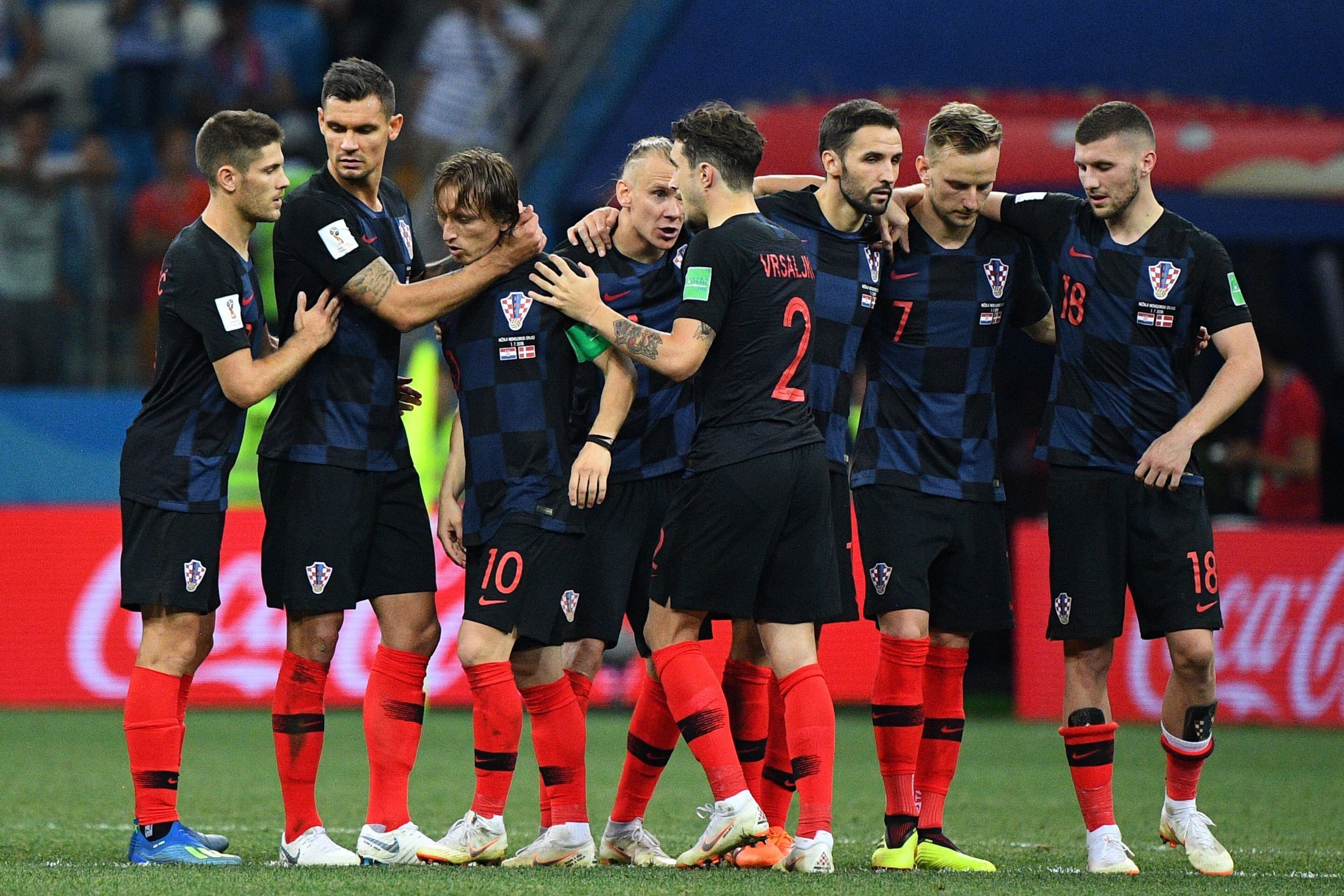 Croatia's midfielder Luka Modric (3rdL) is congratulated by teammates after scoring in the penalty shoot-out at the end of the Russia 2018 World Cup round of 16 football match between Croatia and Denmark at the Nizhny Novgorod Stadium in Nizhny Novgorod o Croatia's midfielder Luka Modric (3rdL) is congratulated by teammates after scoring in the penalty shoot-out at the end of the Russia 2018 World Cup round of 16 football match between Croatia and Denmark at the Nizhny Novgorod Stadium in Nizhny Novgorod o