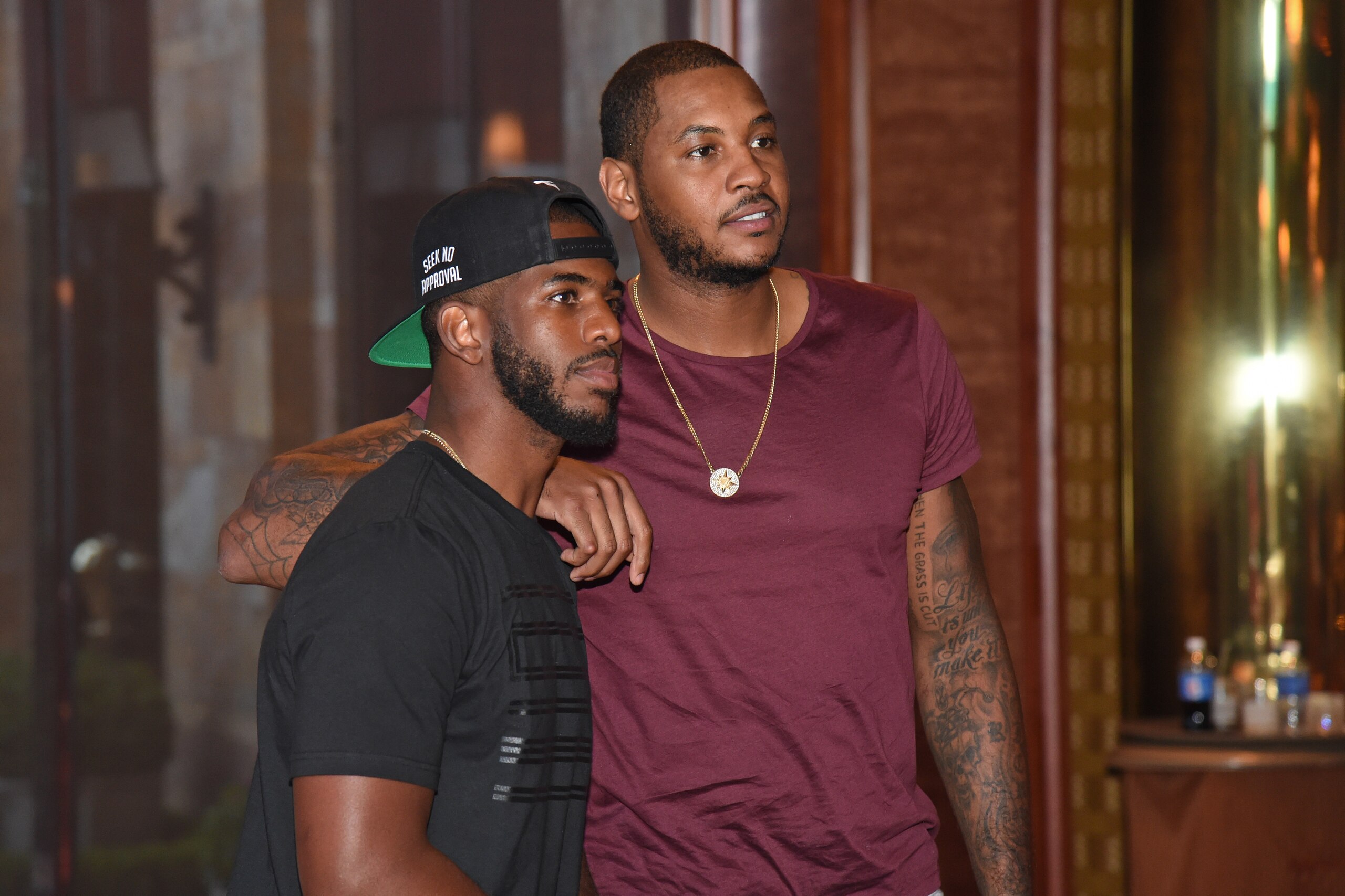 LAS VEGAS, NV - AUGUST 10:  Chris Paul #3 and Carmelo Anthony #7 of the USA National Team sign jerseys and basketballs at the Wynn Las Vegas on August 10, 2015 in Las Vegas, Nevada. NOTE TO USER: User expressly acknowledges and agrees that, by downloading