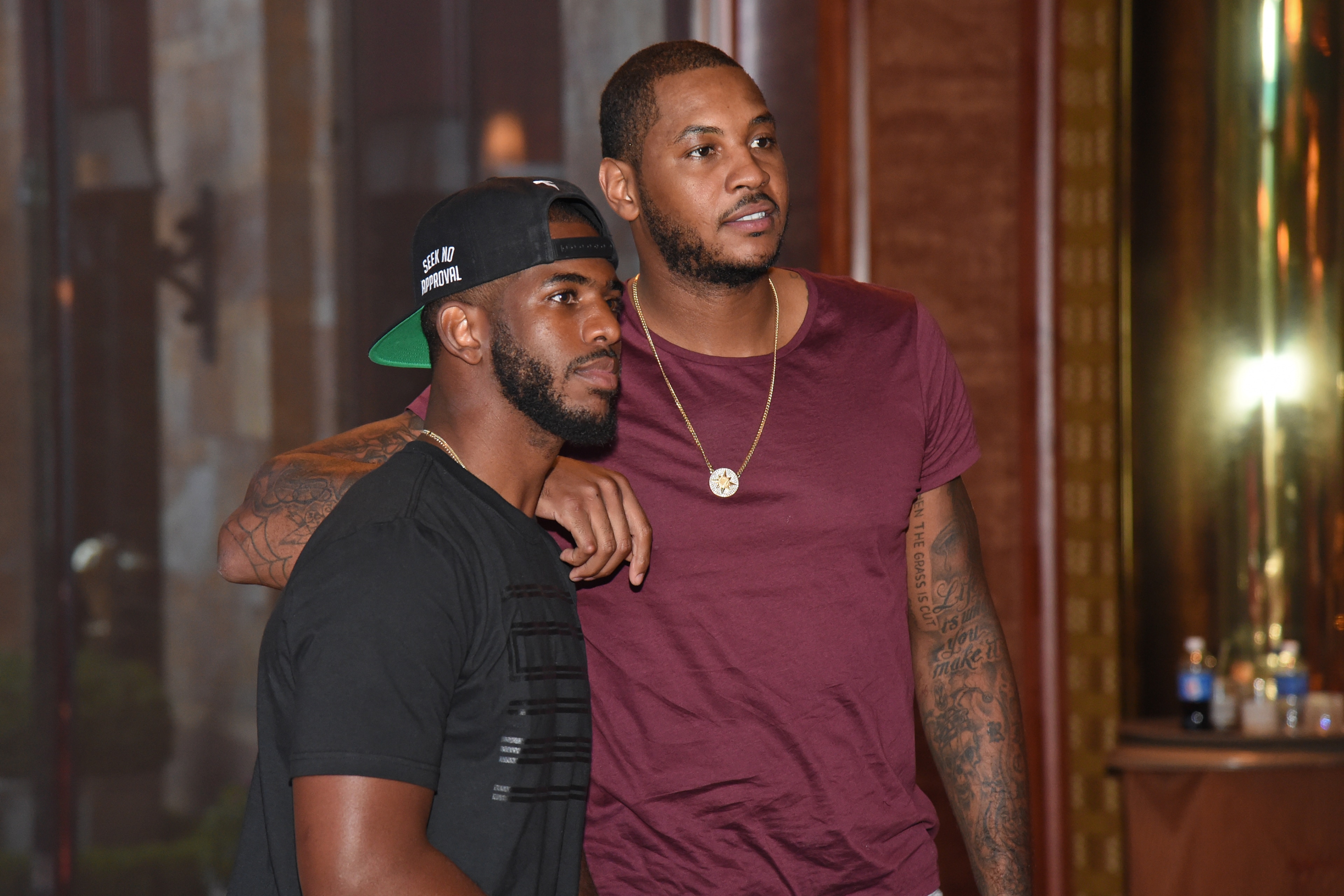 LAS VEGAS, NV - AUGUST 10:  Chris Paul #3 and Carmelo Anthony #7 of the USA National Team sign jerseys and basketballs at the Wynn Las Vegas on August 10, 2015 in Las Vegas, Nevada. NOTE TO USER: User expressly acknowledges and agrees that, by downloading