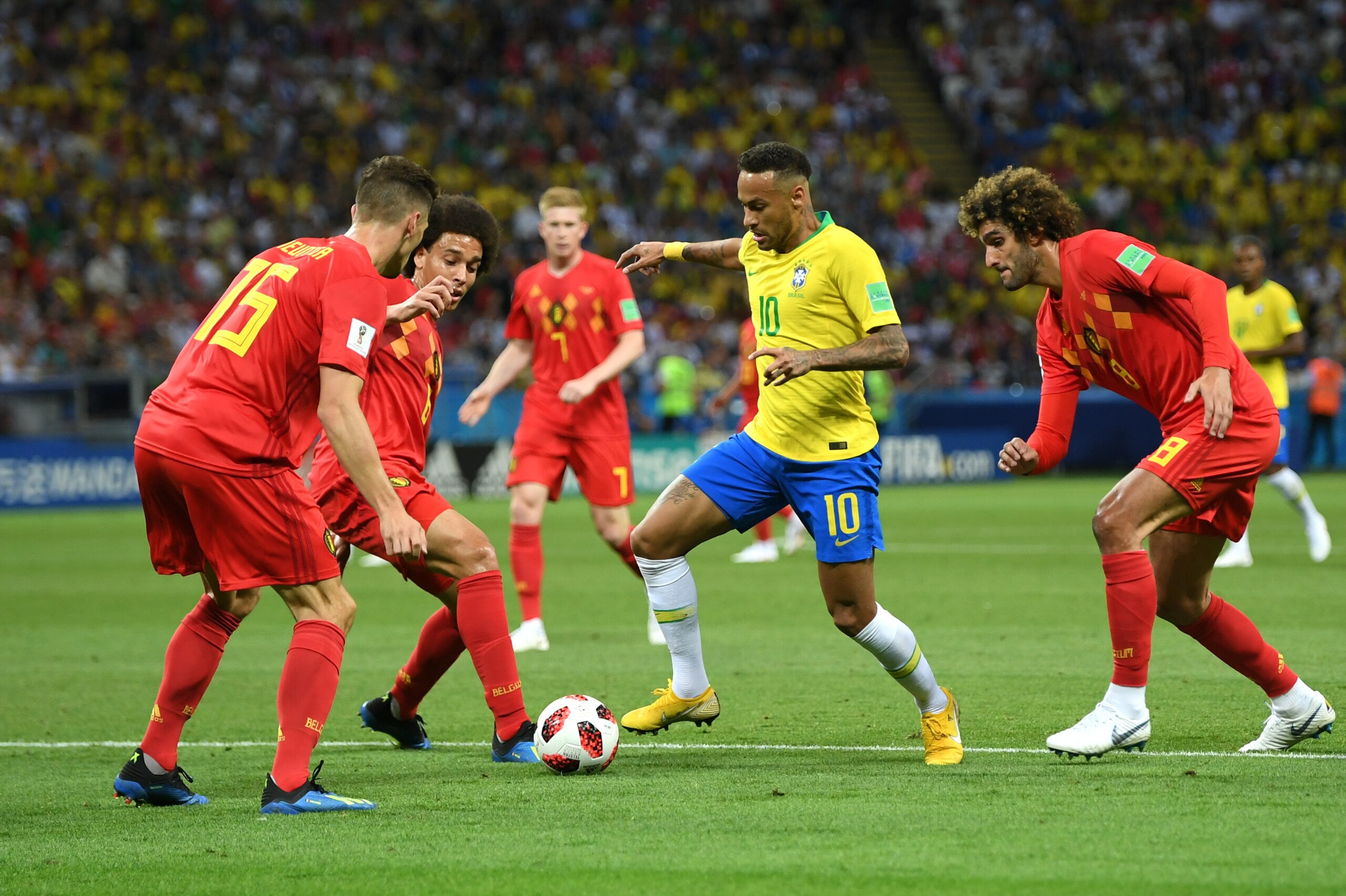 KAZAN, RUSSIA - JULY 06:  Neymar Jr of Brazil challenge for the ball with Thomas Meunier, Axel Witsel and Marouane Fellaini of Belgium during the 2018 FIFA World Cup Russia Quarter Final match between Brazil and Belgium at Kazan Arena on July 6, 2018 in K