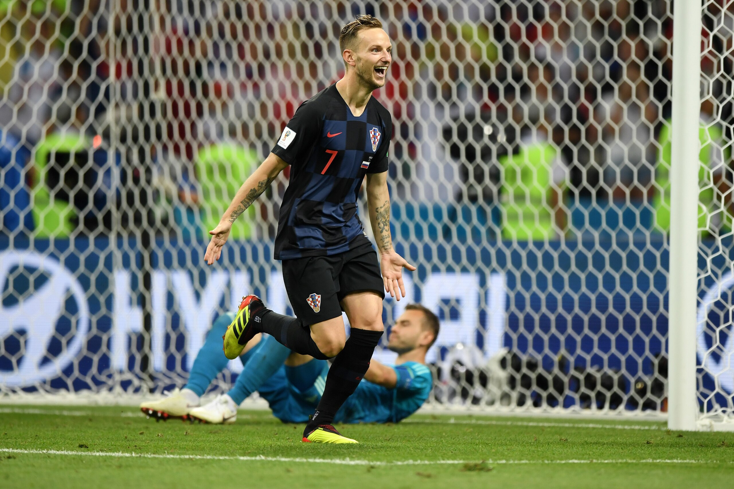 SOCHI, RUSSIA - JULY 07:  Ivan Rakitic of Croatia  scores his sides winning penalty in the penalty shoot out during the 2018 FIFA World Cup Russia Quarter Final match between Russia and Croatia at Fisht Stadium on July 7, 2018 in Sochi, Russia.  (Photo by