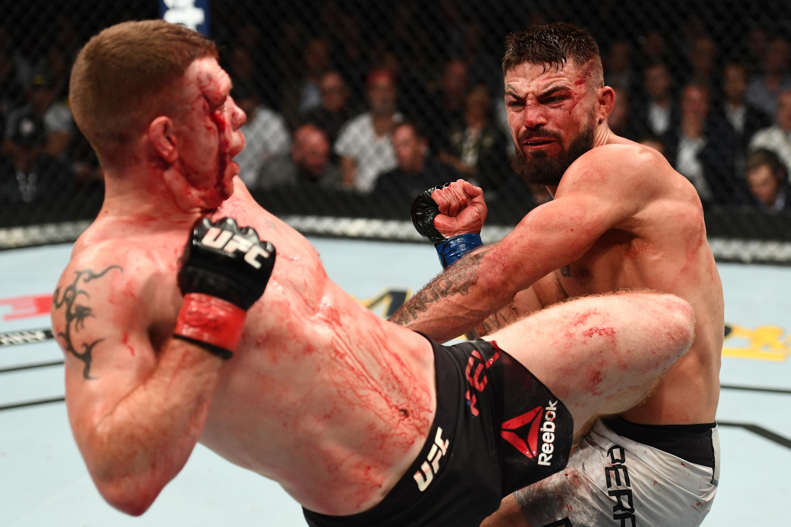 LAS VEGAS, NV - JULY 07:  Paul Felder kicks Mike Perry in their welterweight fight during the UFC 226 event inside T-Mobile Arena on July 7, 2018 in Las Vegas, Nevada.  (Photo by Josh Hedges/Zuffa LLC/Zuffa LLC via Getty Images)