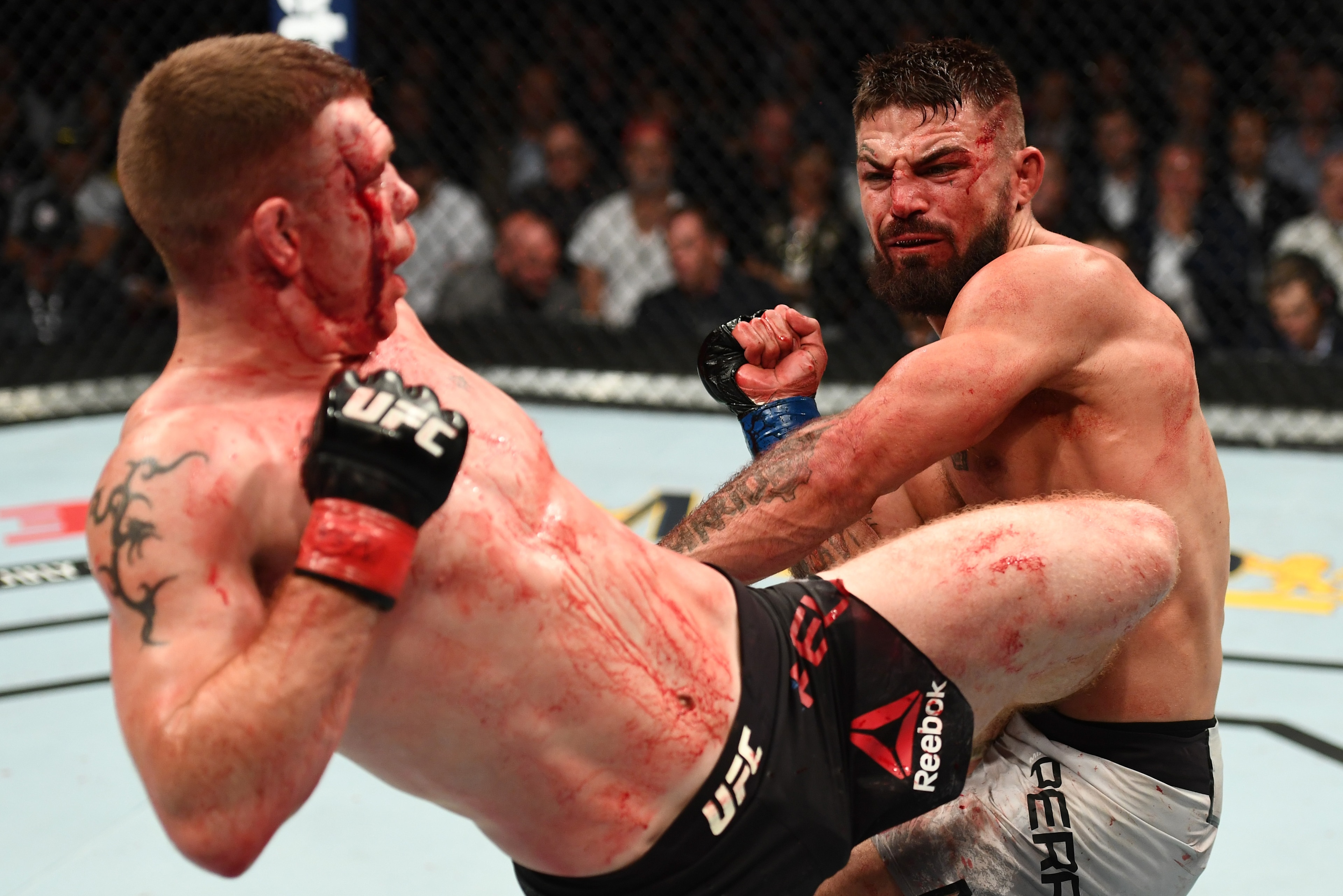 LAS VEGAS, NV - JULY 07:  Paul Felder kicks Mike Perry in their welterweight fight during the UFC 226 event inside T-Mobile Arena on July 7, 2018 in Las Vegas, Nevada.  (Photo by Josh Hedges/Zuffa LLC/Zuffa LLC via Getty Images)