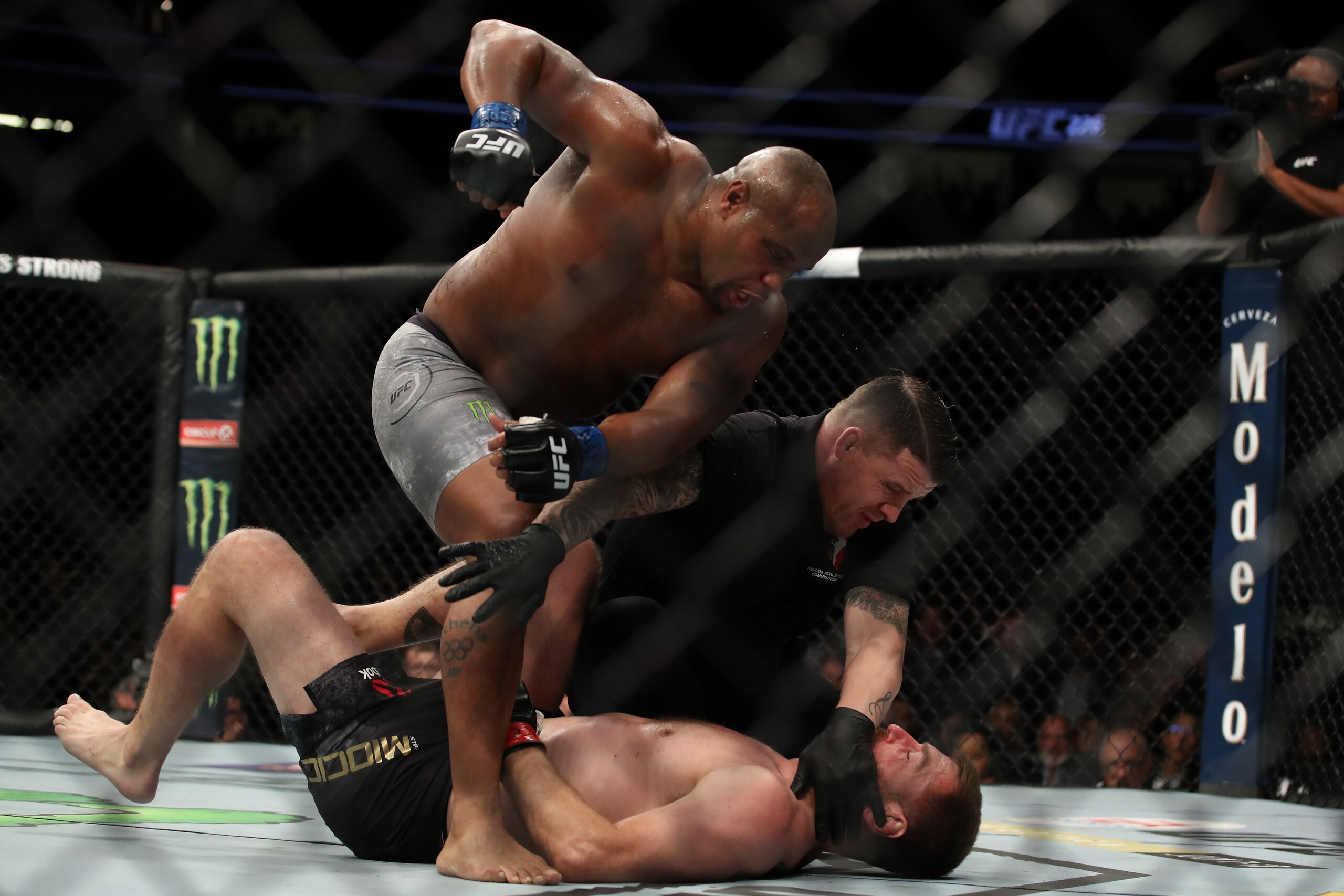 LAS VEGAS, NV - JULY 07:  Daniel Cormier punches Stipe Miocic in their UFC heavyweight championship fight during the UFC 226 event inside T-Mobile Arena on July 7, 2018 in Las Vegas, Nevada.  (Photo by Christian Petersen/Zuffa LLC/Zuffa LLC via Getty Imag