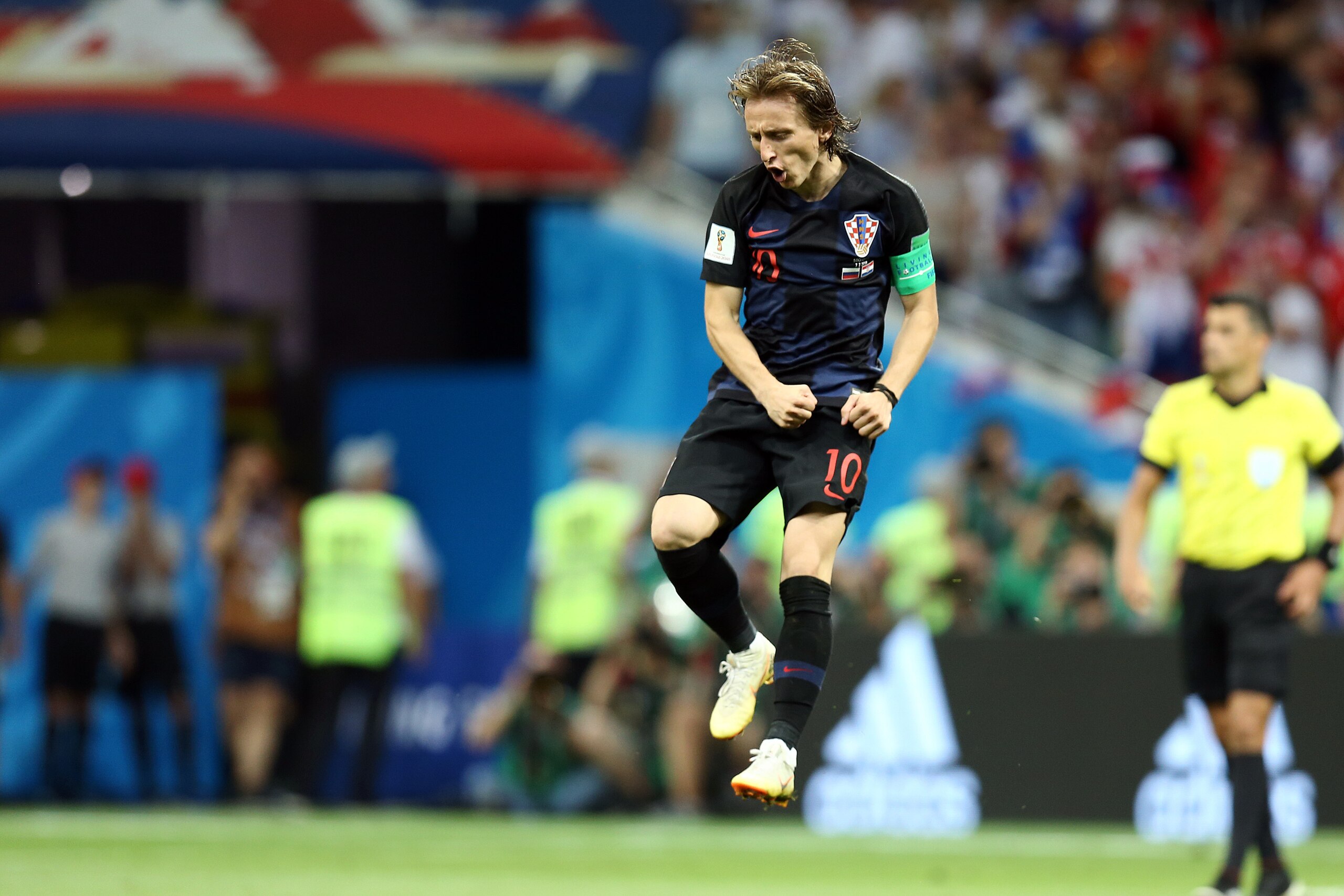 SOCHI, RUSSIA - JULY 07: Luka Modric of Croatia celebrates scoring his team's third penalty in the penalty shoot out   during the 2018 FIFA World Cup Russia Quarter Final match between Russia and Croatia at Fisht Stadium on July 7, 2018 in Sochi, Russia. 