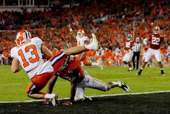 TAMPA, FL - JANUARY 09:  Wide receiver Hunter Renfrow #13 of the Clemson Tigers makes a 2-yard game-winning touchdown reception against defensive back Tony Brown #2 of the Alabama Crimson Tide during the fourth quarter of the 2017 College Football Playoff