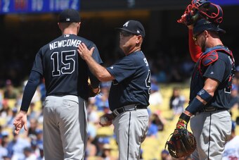 LOS ANGELES, CA - JUNE 10: Sean Newcomb #15 of the Atlanta Braves is pulled from the game in the sixth inning by Brian Snitker #43 as catcher Tyler Flowers #25 looks on against the Los Angeles Dodgers at Dodger Stadium on June 10, 2018 in Los Angeles, Cal