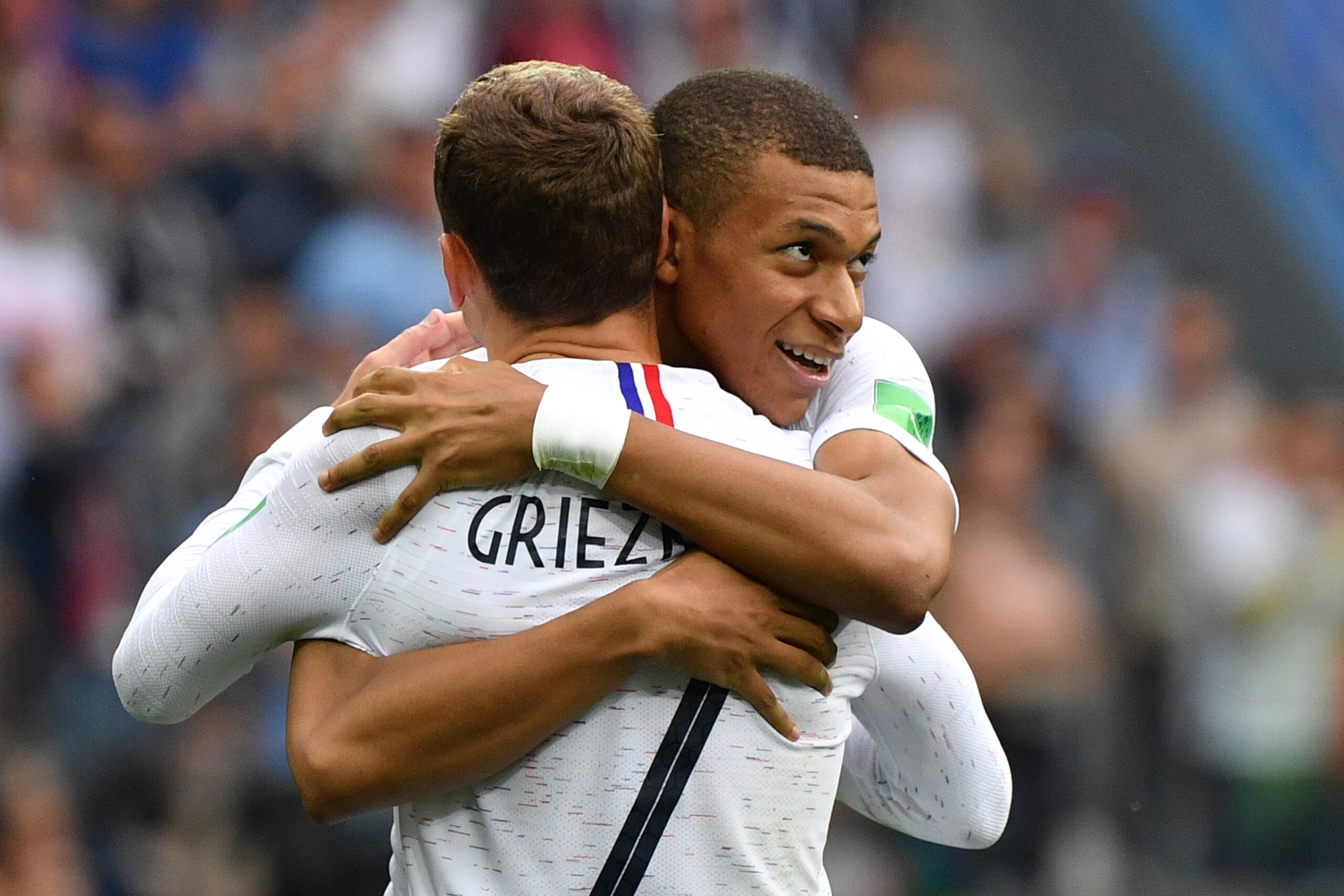 TOPSHOT - France's forward Antoine Griezmann (L) celebrates his goal with France's forward Kylian Mbappe during the Russia 2018 World Cup quarter-final football match between Uruguay and France at the Nizhny Novgorod Stadium in Nizhny Novgorod on July 6, 