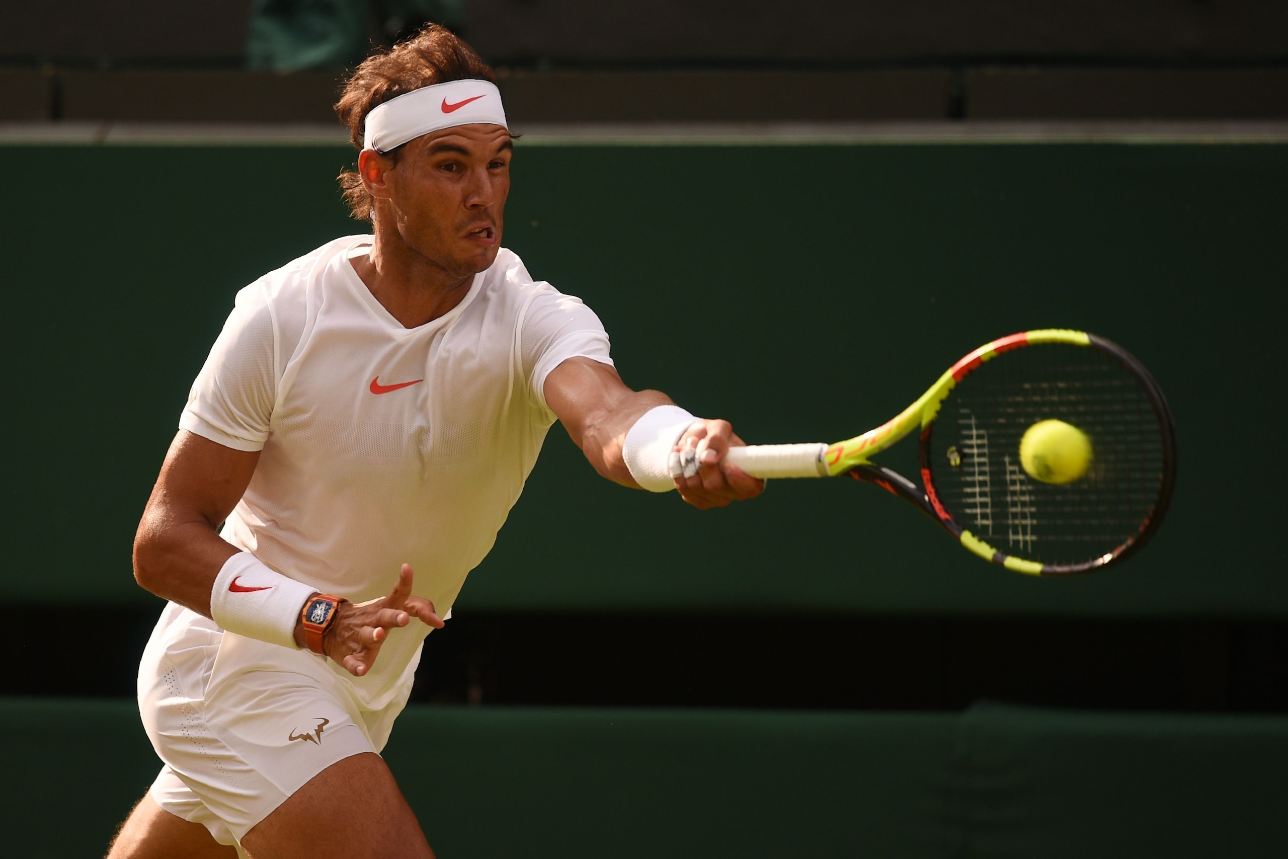 Spain's Rafael Nadal returns to Czech Repbulic's Jiri Vesely in their men's singles fourth round match on the seventh day of the 2018 Wimbledon Championships at The All England Lawn Tennis Club in Wimbledon, southwest London, on July 9, 2018. (Photo by Ol