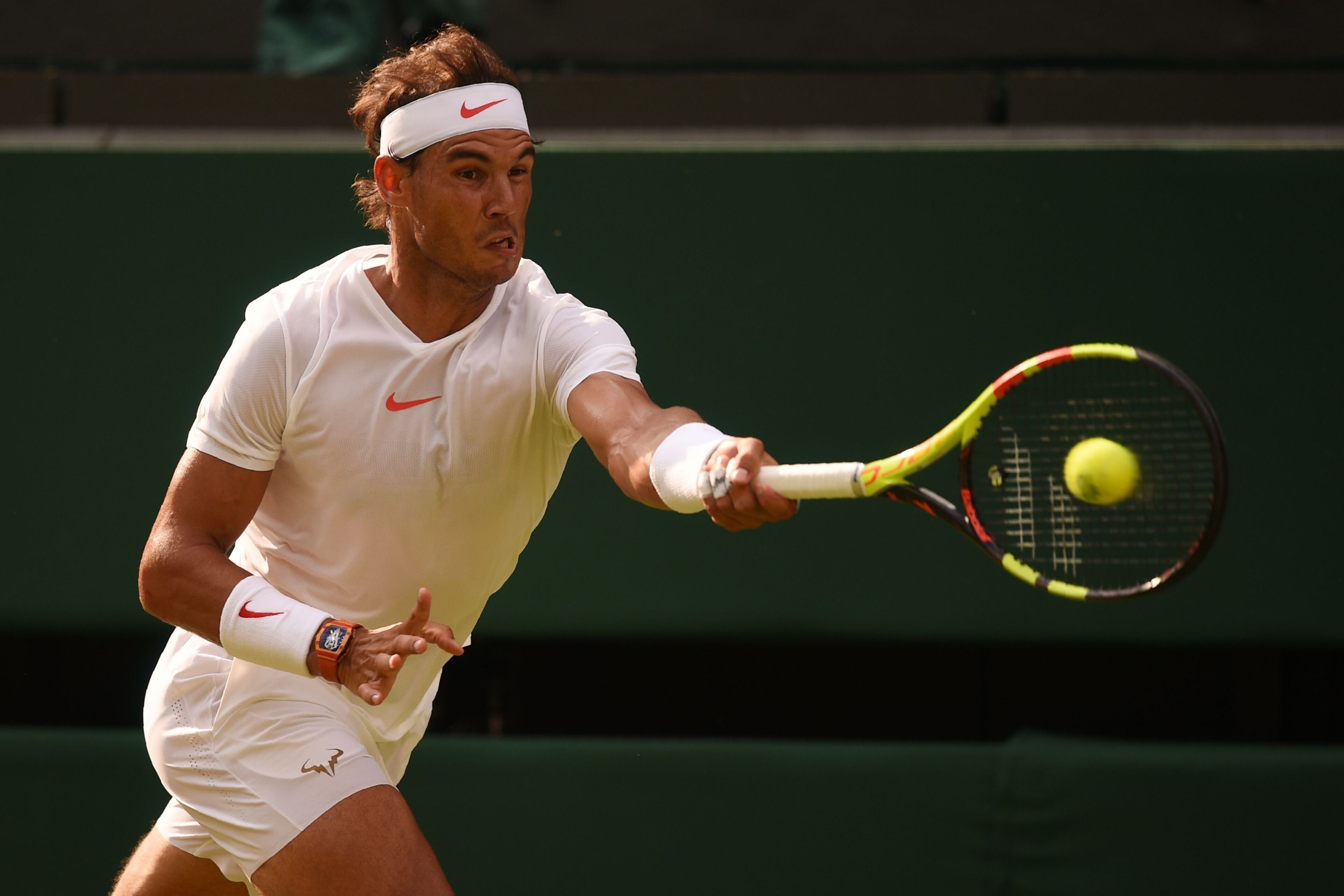 Spain's Rafael Nadal returns to Czech Repbulic's Jiri Vesely in their men's singles fourth round match on the seventh day of the 2018 Wimbledon Championships at The All England Lawn Tennis Club in Wimbledon, southwest London, on July 9, 2018. (Photo by Ol