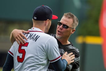 ATLANTA, GA - MARCH 29: Hall of Fame inductee  Chipper Jones walks to the mound to throw out the first pitch to Freddie Freeman before the start of the game against the Philadelphia Phillies on Opening Day at SunTrust Park on March 29, 2018, in Atlanta, G