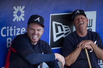 PHILADELPHIA, PA - MAY 23: Freddie Freeman #5 and manager Brian Snitker #43 of the Atlanta Braves share a laugh in the dugout prior to the game against the Philadelphia Phillies at Citizens Bank Park on May 23, 2018 in Philadelphia, Pennsylvania. (Photo b