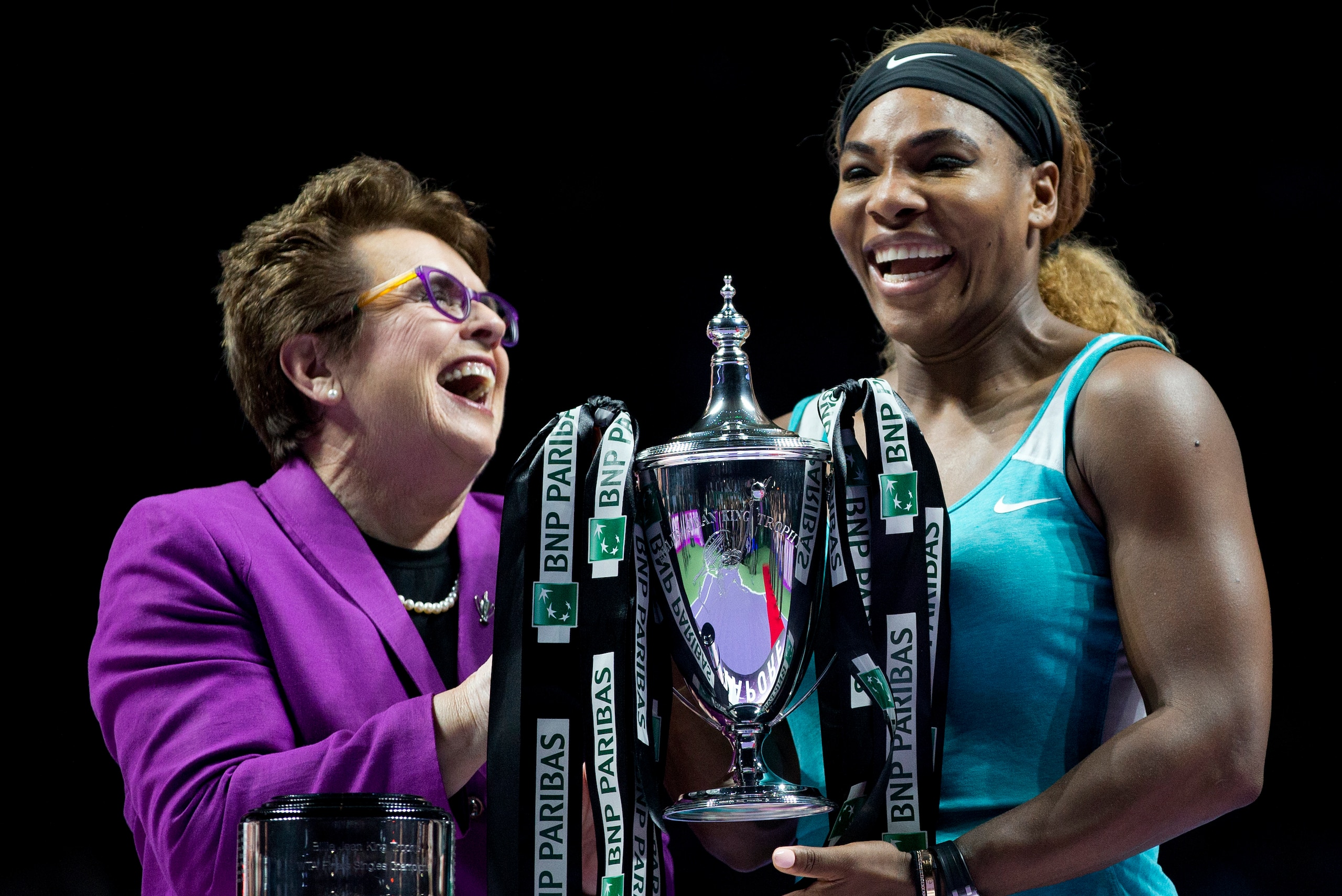Williams celebrates a victory with Billie Jean King in 2014.