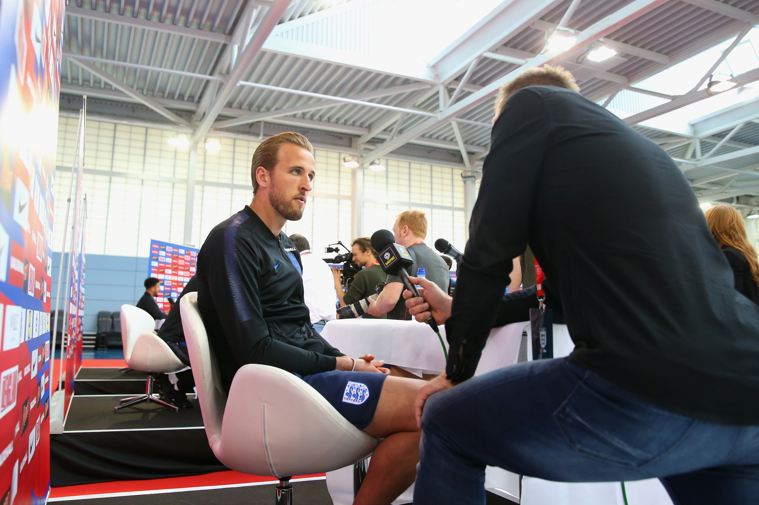 BURTON-UPON-TRENT, ENGLAND - JUNE 05:  Harry Kane of England is interviewed by media during an England media session at St Georges Park on June 5, 2018 in Burton-upon-Trent, England.  (Photo by Alex Livesey/Getty Images)