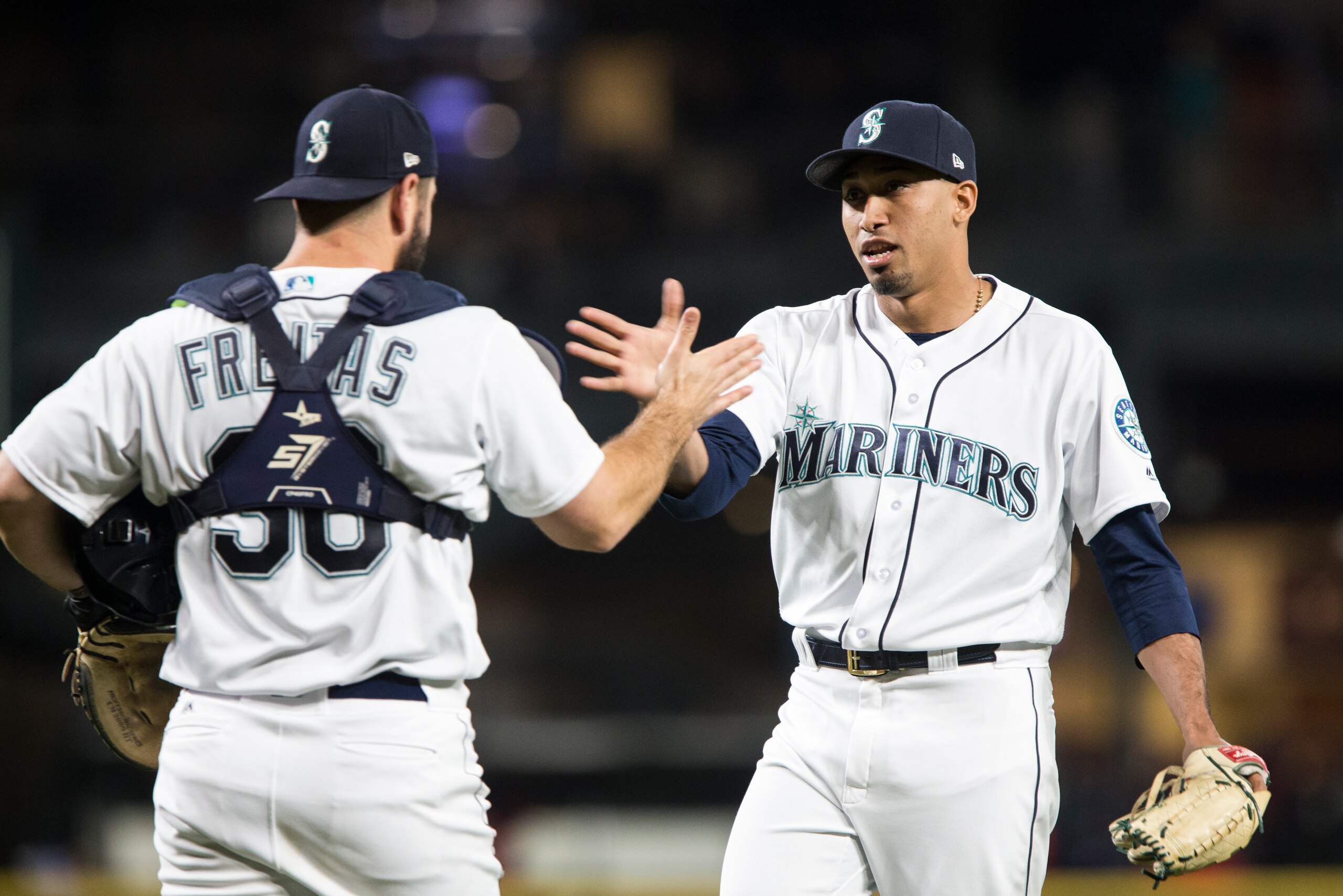 SEATTLE, WA - JUNE 12:  Edwin Diaz #39 of the Seattle Mariners greets David Freitas #36 after earning the save against the Los Angeles Angels of Anaheim at Safeco Field on June 12, 2018 in Seattle, Washington. The Seattle Mariners beat the Los Angeles Ang