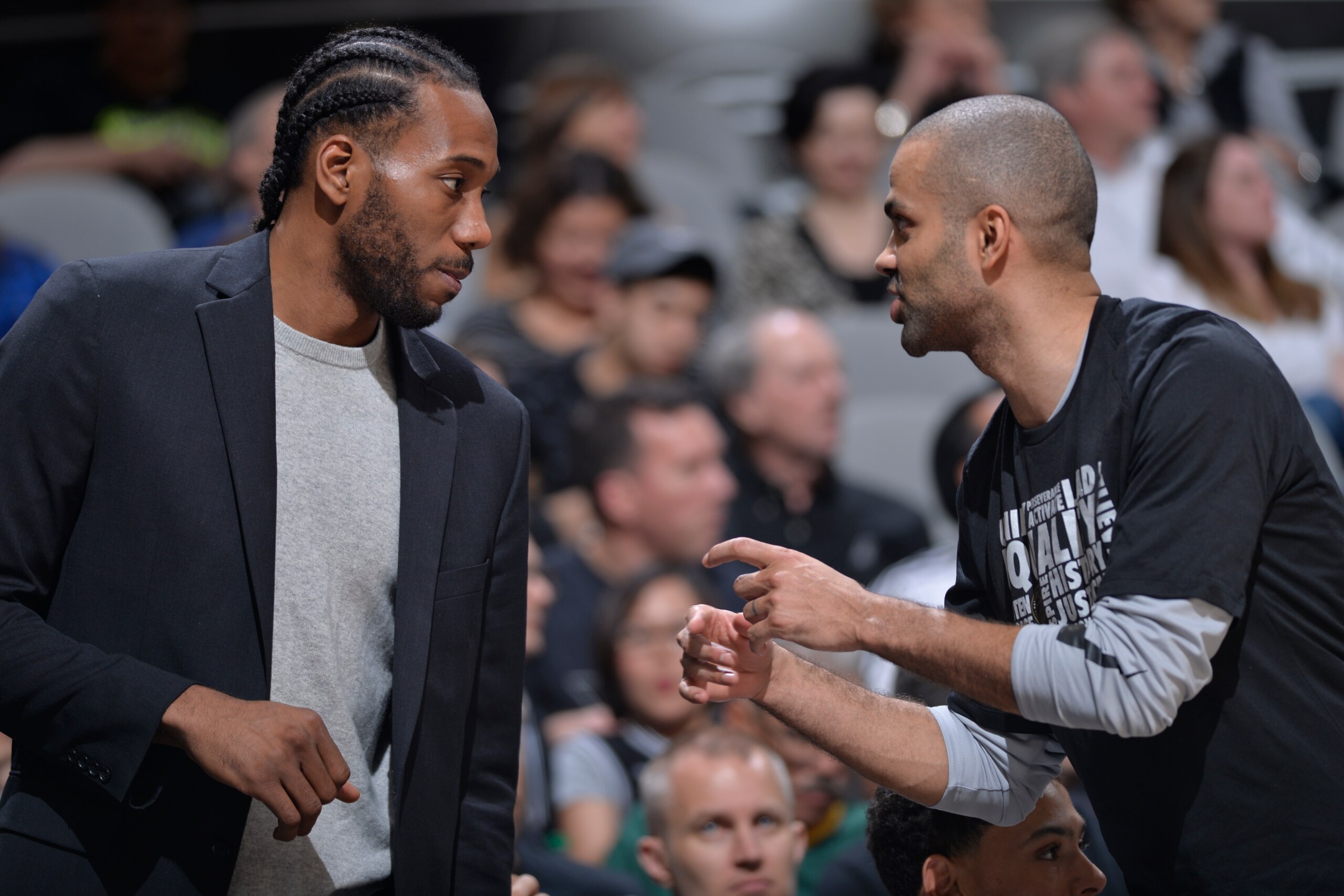 SAN ANTONIO, TX - FEBRUARY 28:  Kawhi Leonard #2 of the San Antonio Spurs talks with Tony Parker #9 of the San Antonio Spurs during the game against the New Orleans Pelicans on February 28, 2018 at the AT&T Center in San Antonio, Texas. NOTE TO USER: User