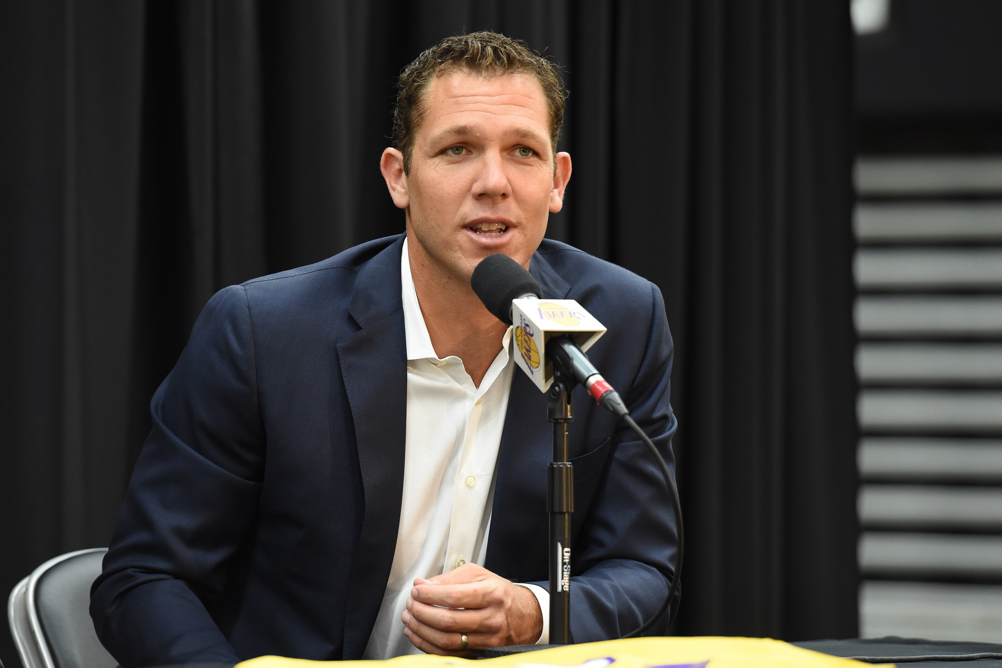 EL SEGUNDO, CA - JUNE 26: Luke Walton of the Los Angeles Lakers helps introduce 2018 NBA draft pick Moritz Wagner during an introductory press conference at the UCLA Health Training Center on June 26, 2018 in El Segundo, California. NOTE TO USER: User exp