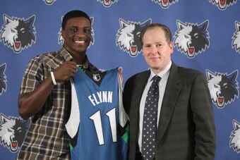 MINNEAPOLIS - JUNE 26:  David Kahn, President of Basketball Operations of the Minnesota Timberwolves introduces 2009 NBA first round draft selections Jonny Flynn and Wayne Ellington to the media at a press  conference on June 26, 2009 at the Target Center