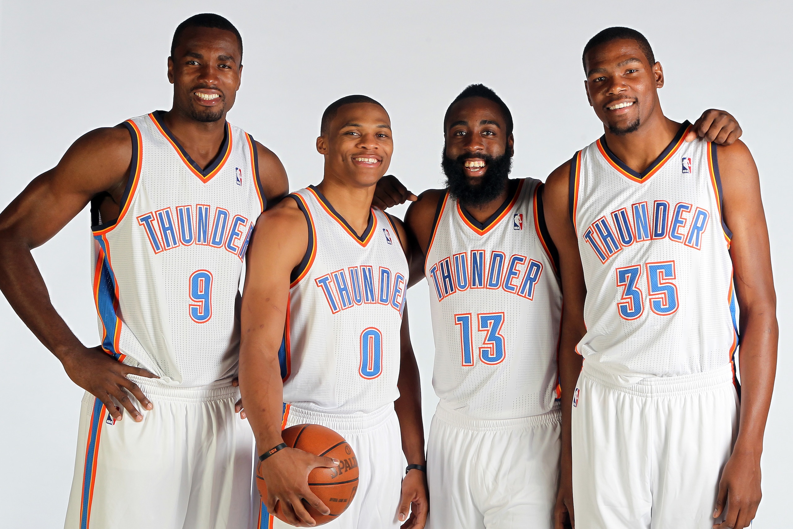 EDMOND, OK - OCTOBER 1: Serge Ibaka #9, Russell Westbrook #0, James Harden #13 and Kevin Durant of the Oklahoma City Thunder pose for a portrait during 2012 NBA Media Day on October 1, 2012 at the Thunder Events Center in Edmond, Oklahoma. NOTE TO USER: U EDMOND, OK - OCTOBER 1: Serge Ibaka #9, Russell Westbrook #0, James Harden #13 and Kevin Durant of the Oklahoma City Thunder pose for a portrait during 2012 NBA Media Day on October 1, 2012 at the Thunder Events Center in Edmond, Oklahoma. NOTE TO USER: U