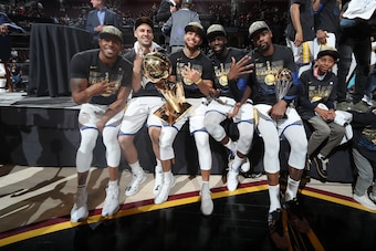 CLEVELAND, OH - JUNE 8: Andre Iguodala #9, Klay Thompson #11, Stephen Curry #30, Draymond Green #23, and Kevin Durant #35 of the Golden State Warriors pose with the Larry O'Brien Championship Trophy after Game Four of the 2018 NBA Finals against the Cleve