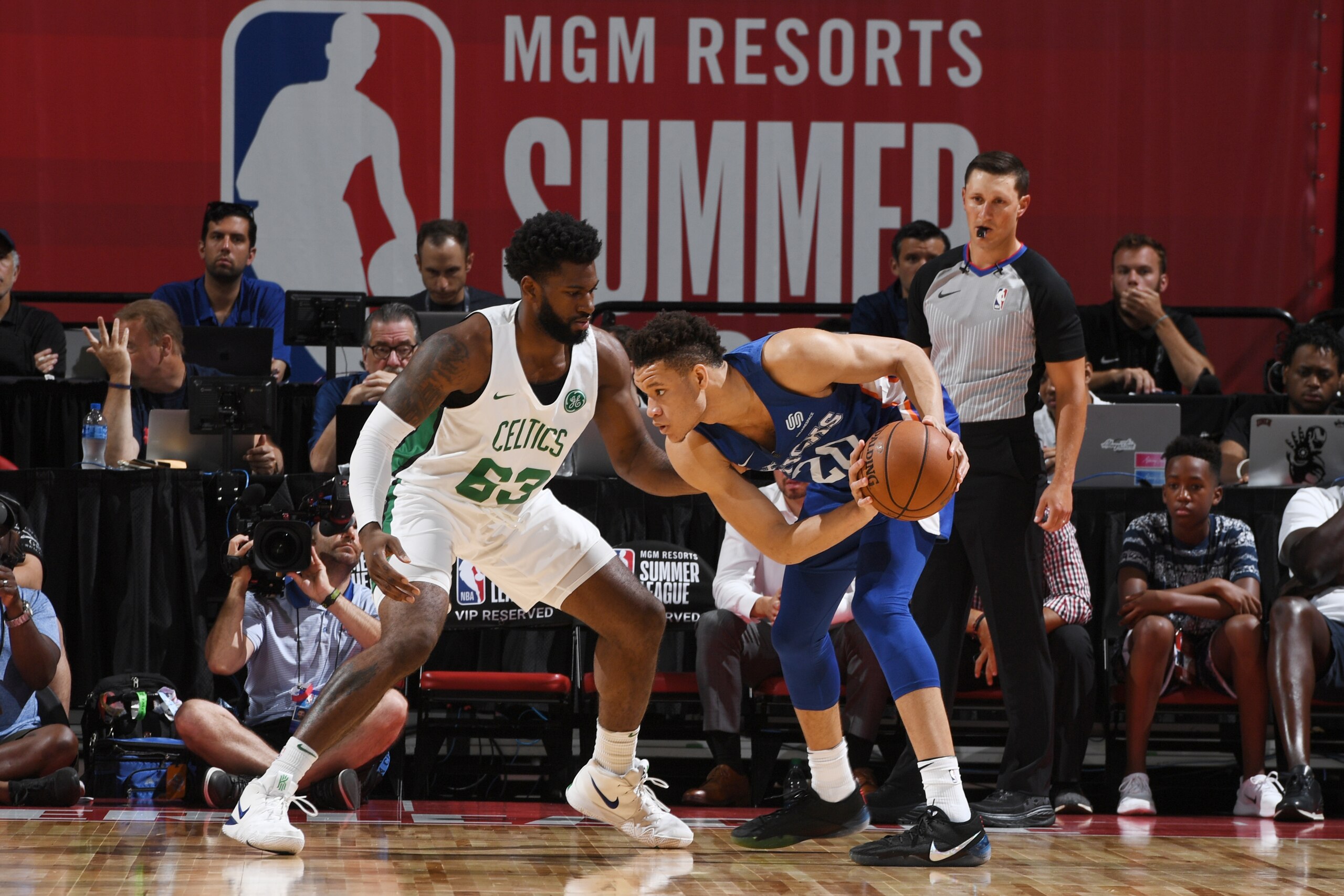 LAS VEGAS, NV - JULY 12: Kevin Knox #20 of the New York Knicks handles the ball against Hassan Martin #63 of the Boston Celtics during the 2018 Las Vegas Summer League on July 12, 2018 at the Thomas & Mack Center in Las Vegas, Nevada. NOTE TO USER: User LAS VEGAS, NV - JULY 12: Kevin Knox #20 of the New York Knicks handles the ball against Hassan Martin #63 of the Boston Celtics during the 2018 Las Vegas Summer League on July 12, 2018 at the Thomas & Mack Center in Las Vegas, Nevada. NOTE TO USER: User