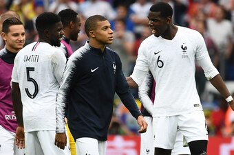 France's forward Kylian Mbappe (2R) and France's midfielder Paul Pogba (R) celebrate at the end of the Russia 2018 World Cup quarter-final football match between Uruguay and France at the Nizhny Novgorod Stadium in Nizhny Novgorod on July 6, 2018. (Photo 