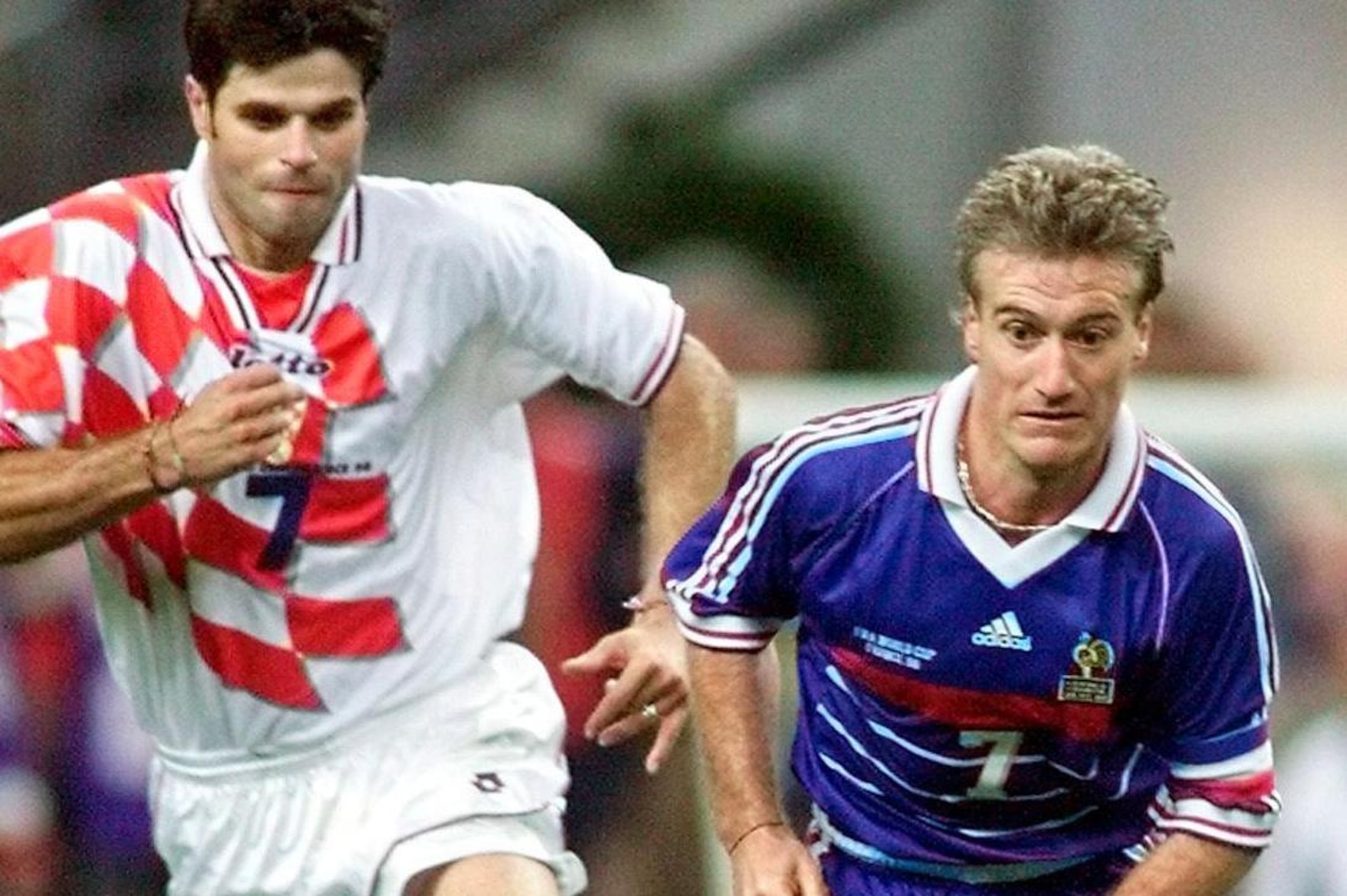 CLAIREFONTAINE, FRANCE:  French captain and midfielder Didier Deschamps (R) is challenged by Croatian midfielder Aljosa Asanovic 08 July at the Stade de France in Saint-Denis, north of Paris, during the 1998 Soccer World Cup semifinal match between France