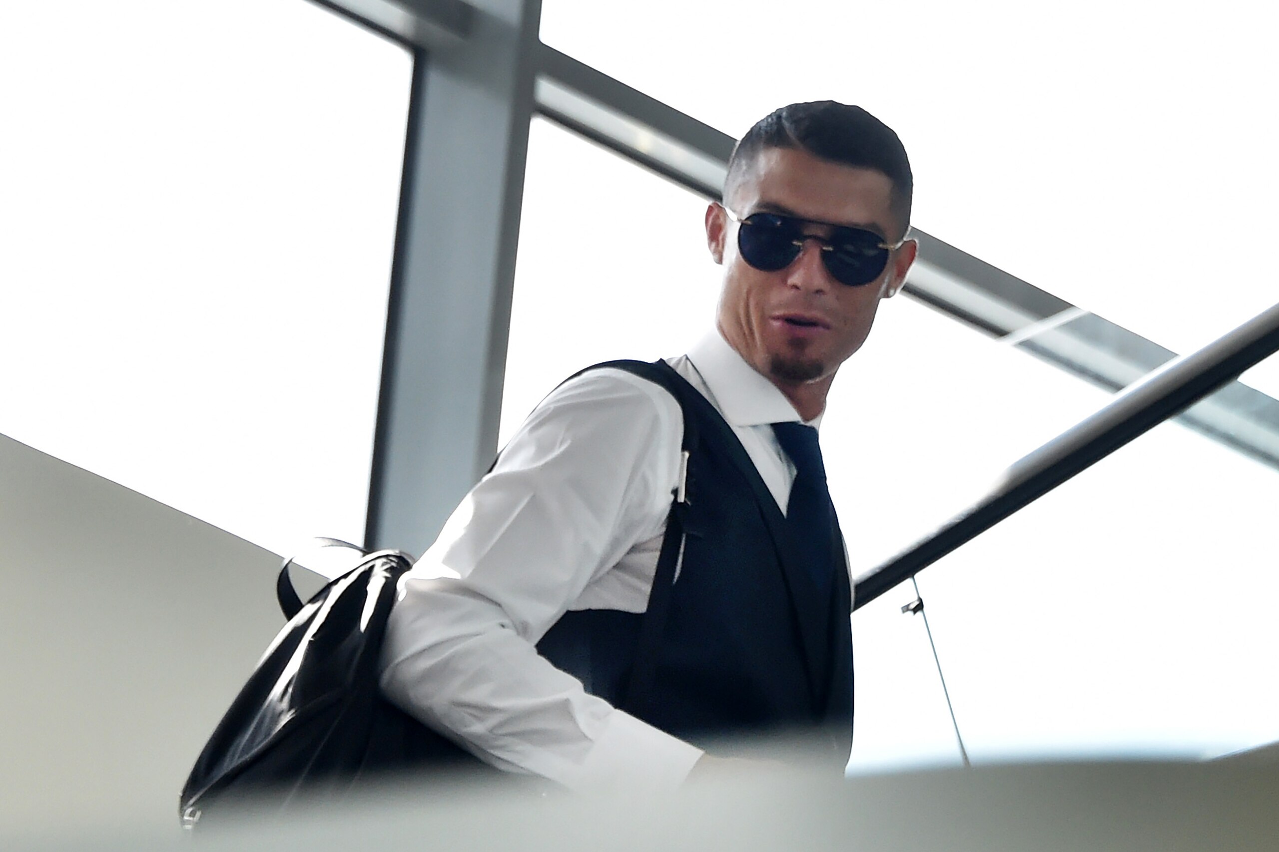 Portugal's forward Cristiano Ronaldo arrives at the Zhukovsky airport, about 40 km southeast of Moscow, on July 1, 2018, as Portugal's team departs following their loss the previous day to Uruguay in their Russia 2018 World Cup round of 16 football match. Portugal's forward Cristiano Ronaldo arrives at the Zhukovsky airport, about 40 km southeast of Moscow, on July 1, 2018, as Portugal's team departs following their loss the previous day to Uruguay in their Russia 2018 World Cup round of 16 football match.