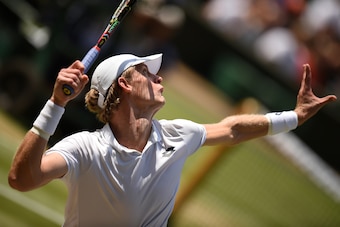 TOPSHOT - South Africa's Kevin Anderson serves against US player John Isner during their men's singles semi-final match on the eleventh day of the 2018 Wimbledon Championships at The All England Lawn Tennis Club in Wimbledon, southwest London, on July 13,