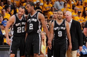 OAKLAND, CA - MAY 12: Manu Ginobili #20, Kawhi Leonard #2, Danny Green #4, Tony Parker #9 and Head Coach Gregg Popovich of the San Antonio Spurs face the Golden State Warriors in Game Four of the Western Conference Semifinals during the 2013 NBA Playoffs