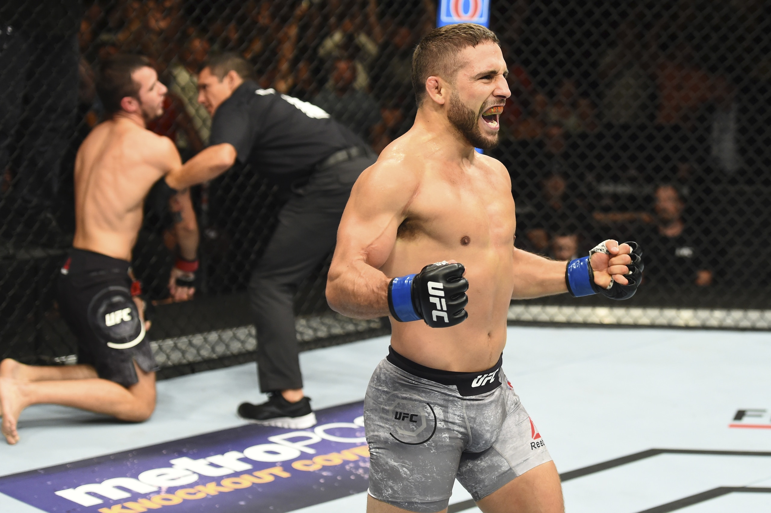 BOISE, ID - JULY 14:  (R-L) Chad Mendes celebrates after defeating Myles Jury by TKO in their featherweight fight during the UFC Fight Night event inside CenturyLink Arena on July 14, 2018 in Boise, Idaho. (Photo by Josh Hedges/Zuffa LLC/Zuffa LLC via Get
