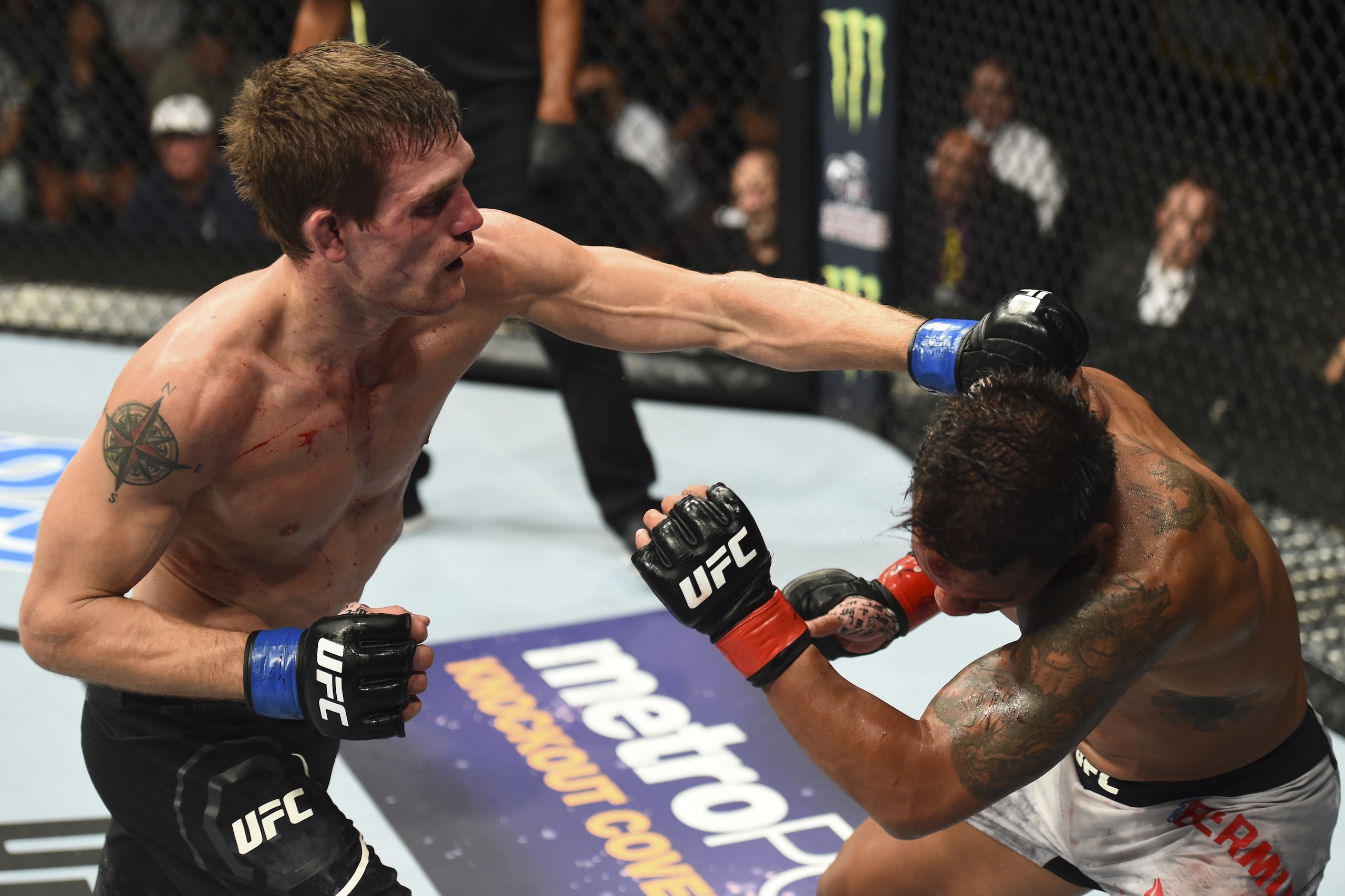 BOISE, ID - JULY 14:  (L-R) Rick Glenn punches Dennis Bermudez in their featherweight fight during the UFC Fight Night event inside CenturyLink Arena on July 14, 2018 in Boise, Idaho. (Photo by Josh Hedges/Zuffa LLC/Zuffa LLC via Getty Images)