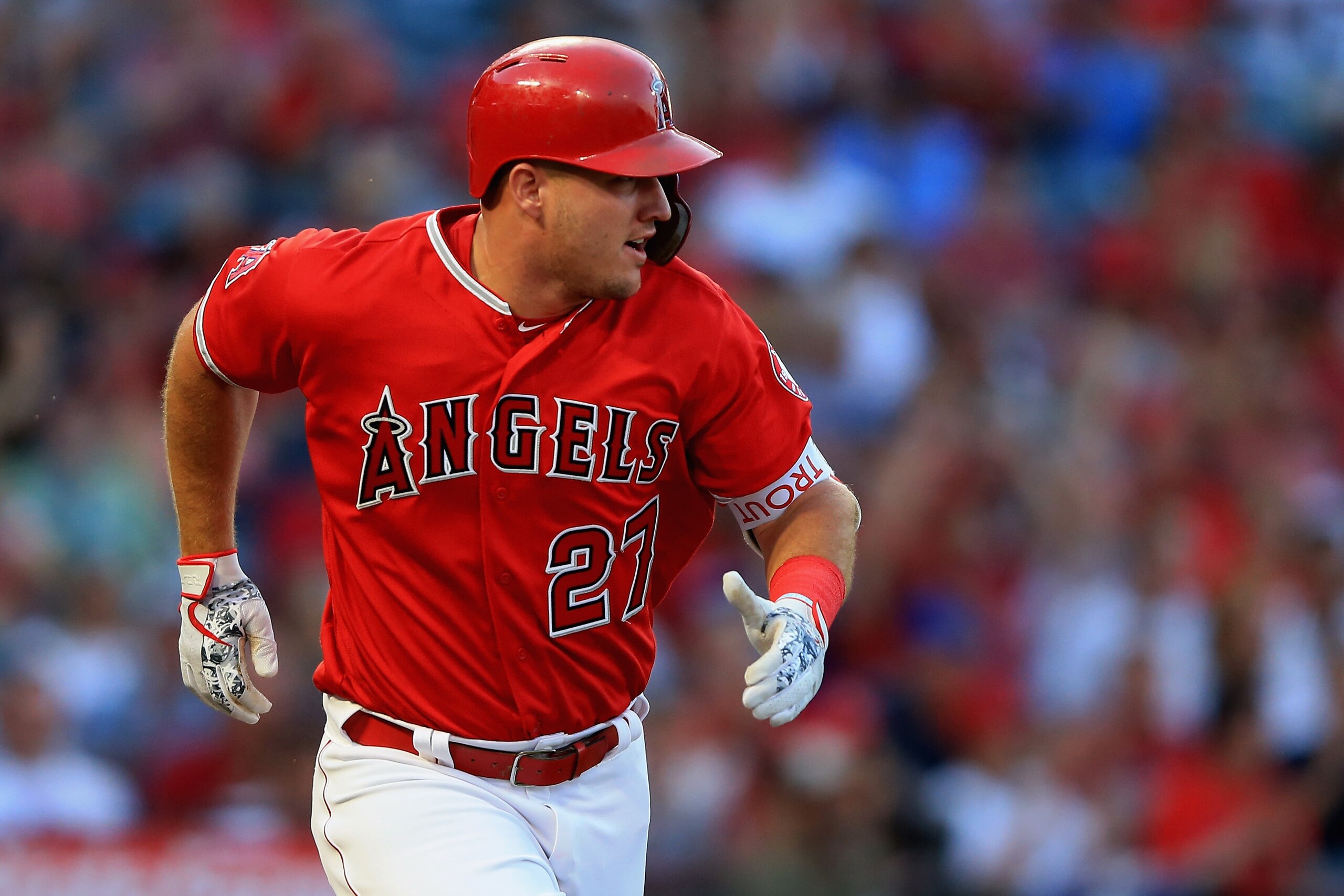 ANAHEIM, CA - JULY 12:  Mike Trout #27 of the Los Angeles Angels of Anaheim runs to first base after hitting a single during the first  inning of a game against the Seattle Mariners at Angel Stadium on July 12, 2018 in Anaheim, California.  (Photo by Sean