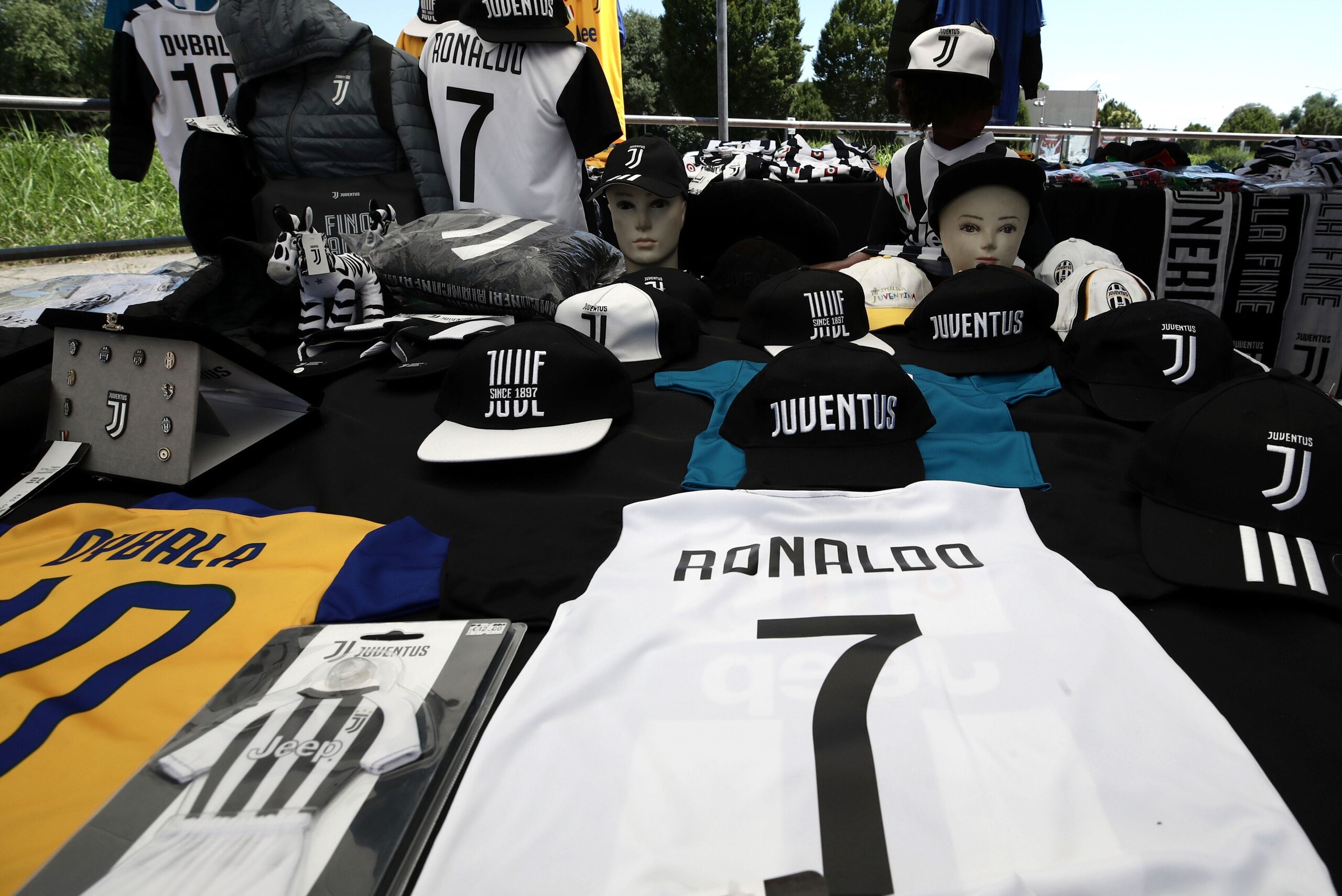 A picture taken on July 7, 2018 in Turin shows a Cristiano Ronaldo's Juventus T-shirt in a stand near the Allianz Stadium in Turin. - Spain's media said goodbye to superstar Cristiano Ronaldo while Italy's welcomed him on Friday after persistent reports t