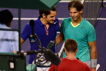 Rafael Nadal (R) of Spain is congratulated by Roger Federer (L) of Switzerland on March 14, 2013 in Indian Wells, California, after Nadal won their quarterfinal match at the BNP Paribas Open.  Nadal continued his return from injury with a straight-sets tr