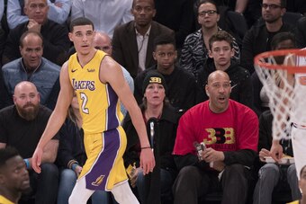 NEW YORK, NY - DECEMBER 12: Lonzo Ball #2 of the Los Angeles Lakers with his father LaVar Ball and his mother Tina Ball during the game against the New York Knicks at Madison Square Garden on December 12, 2017 in New York City. NOTE TO USER: User expressl