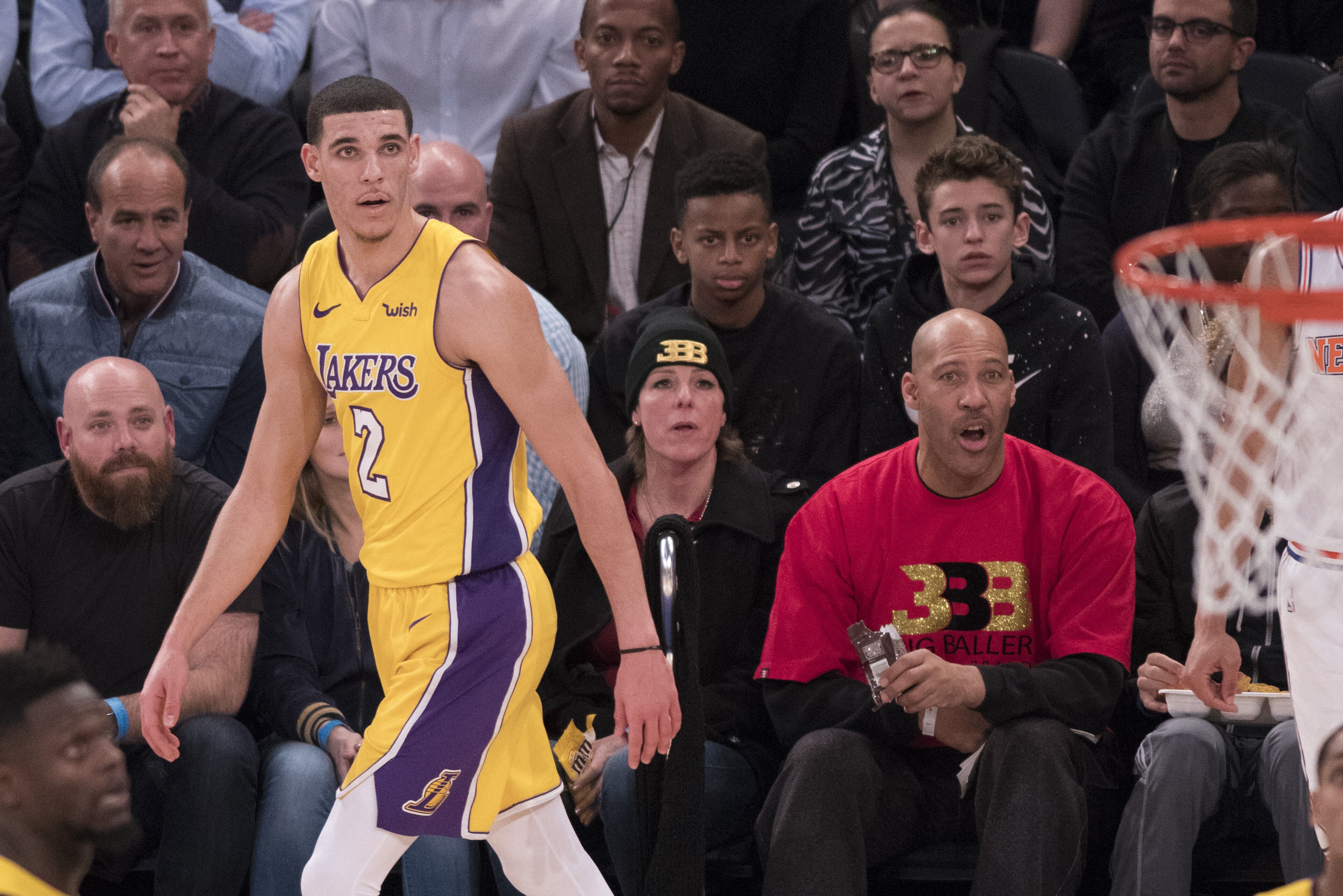 NEW YORK, NY - DECEMBER 12: Lonzo Ball #2 of the Los Angeles Lakers with his father LaVar Ball and his mother Tina Ball during the game against the New York Knicks at Madison Square Garden on December 12, 2017 in New York City. NOTE TO USER: User expressl