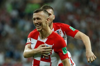 Croatia's forward Ivan Perisic celebrates with his teammate forward Ante Rebic after scoring the 1-1 equalizer during the Russia 2018 World Cup final football match between France and Croatia at the Luzhniki Stadium in Moscow on July 15, 2018. (Photo by O
