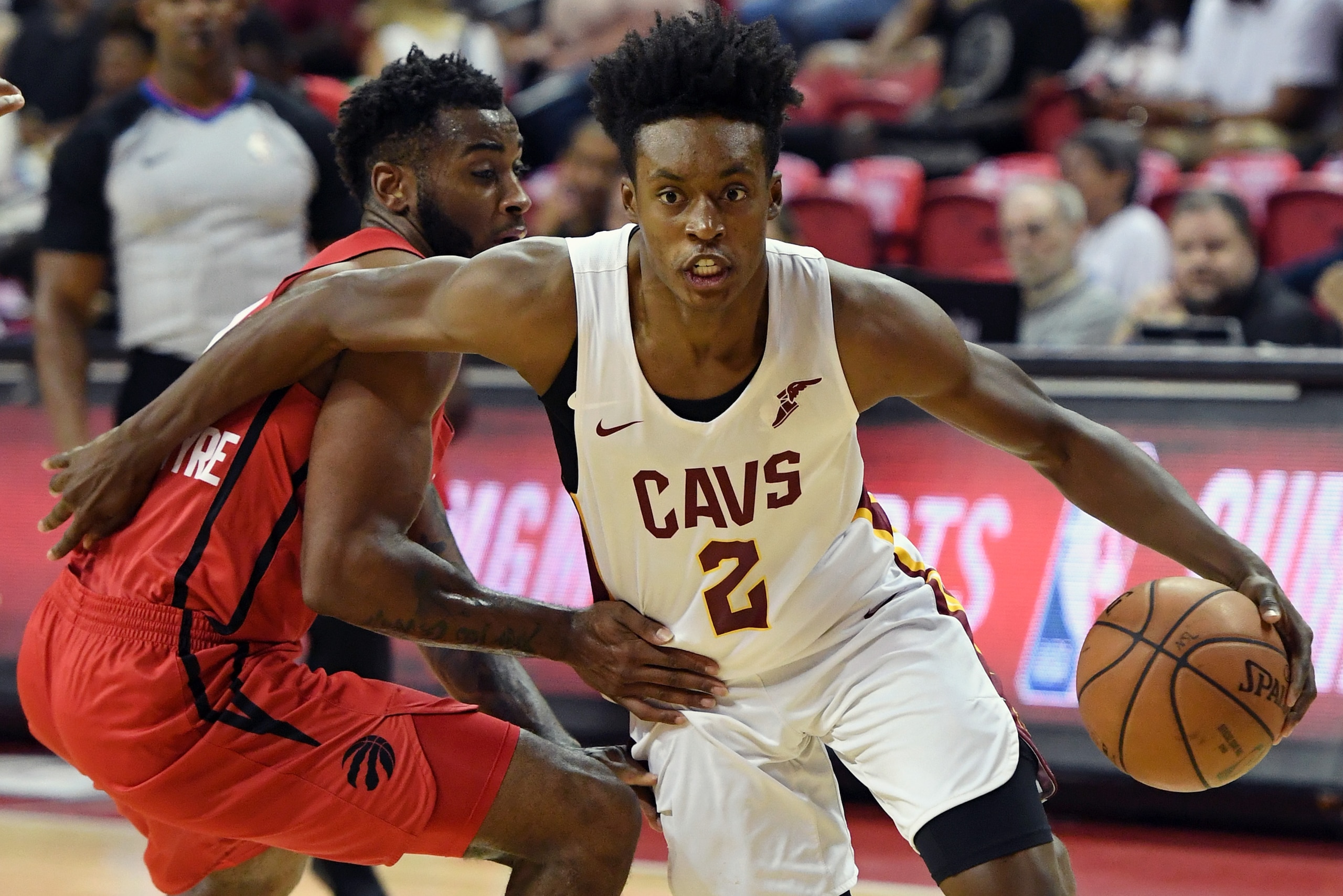 LAS VEGAS, NV - JULY 15:  Collin Sexton #2 of the Cleveland Cavaliers drives against Codi Miller-McIntyre #11 of the Toronto Raptors during a quarterfinal game of the 2018 NBA Summer League at the Thomas & Mack Center on July 15, 2018 in Las Vegas, Nevada