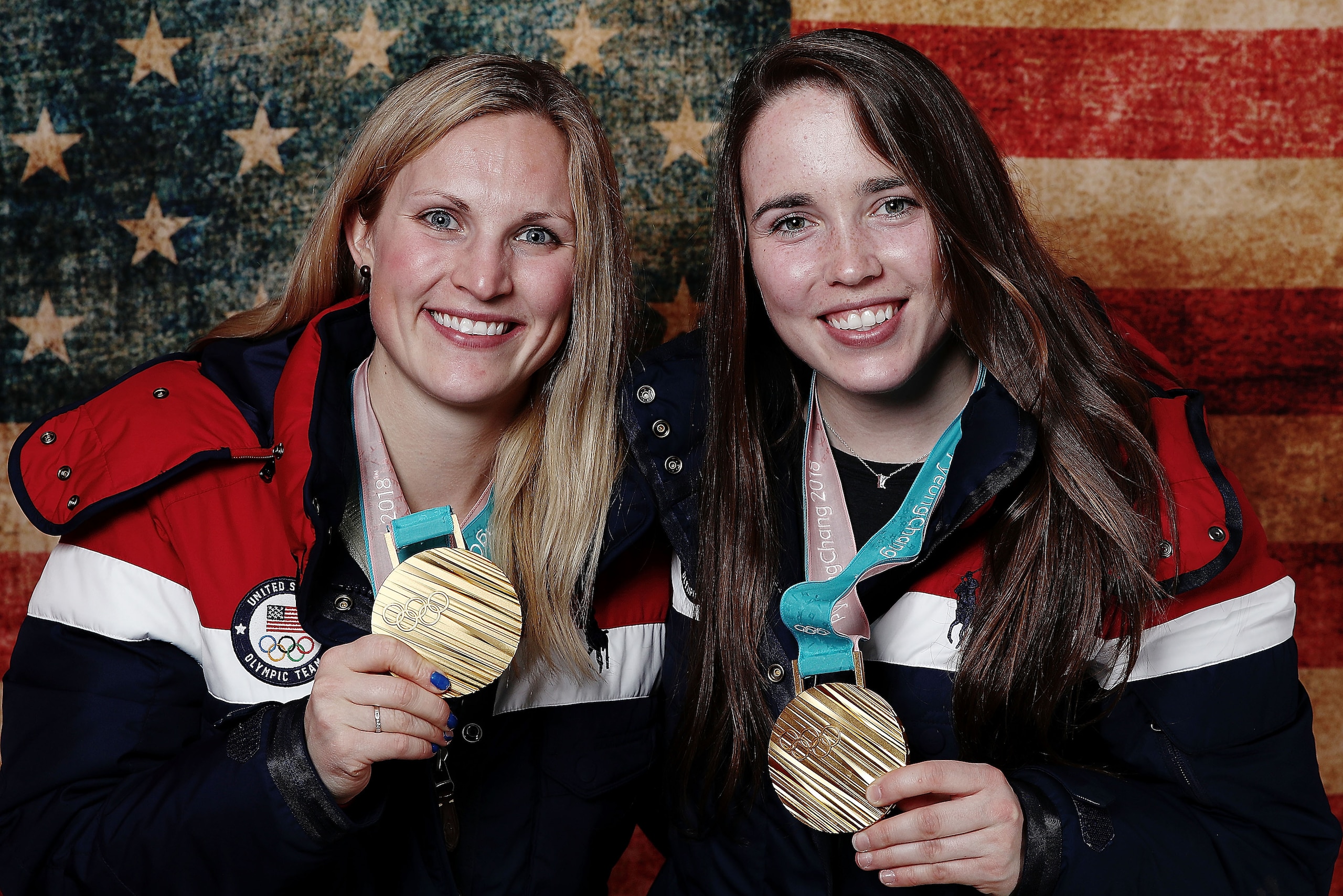 GANGNEUNG, SOUTH KOREA - FEBRUARY 22:  (BROADCAST-OUT) United States Women's Hockey players Jocelyne Lamoureux and Madeline Rooney pose with their gold medals on the Today Show Set on February 22, 2018 in Gangneung, South Korea.  (Photo by Marianna Massey