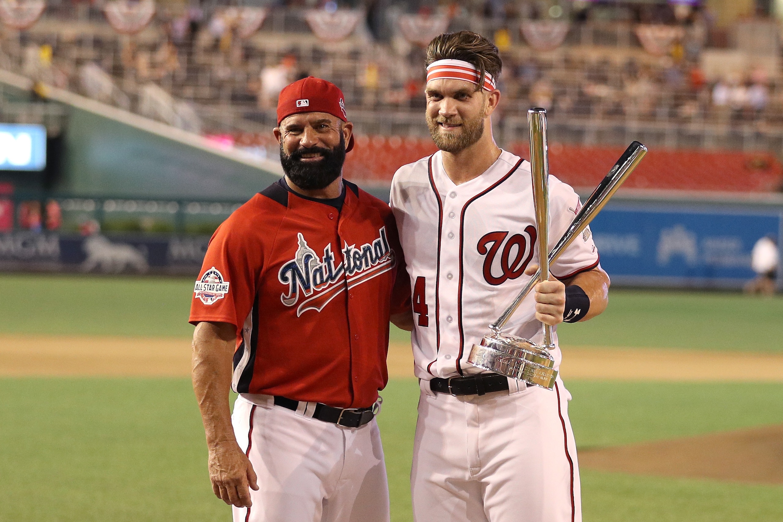 WASHINGTON, DC - JULY 16:  Bryce Harper of the Washington Nationals and National League celebrates with the trophy and father Ron Harper after winning the T-Mobile Home Run Derby at Nationals Park on July 16, 2018 in Washington, DC.  Harper defeated Kyle 