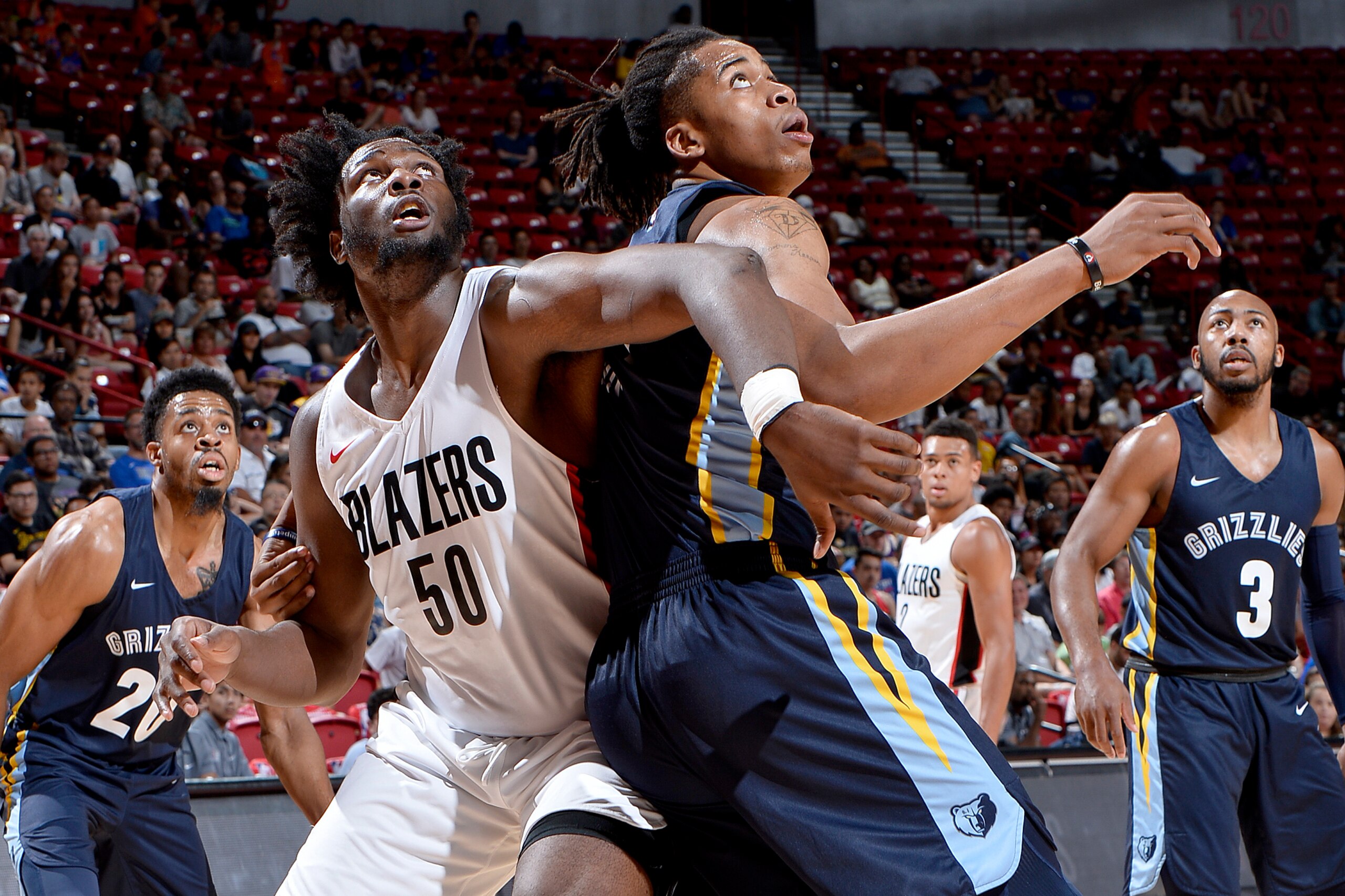 LAS VEGAS, NV - JULY 16: Caleb Swanigan #50 of the Portland Trail Blazers battles for position against Deyonta Davis #21 of Memphis Grizzlies during the 2018 Las Vegas Summer League on July 16, 2018 at the Thomas & Mack Center in Las Vegas, Nevada. NOTE T