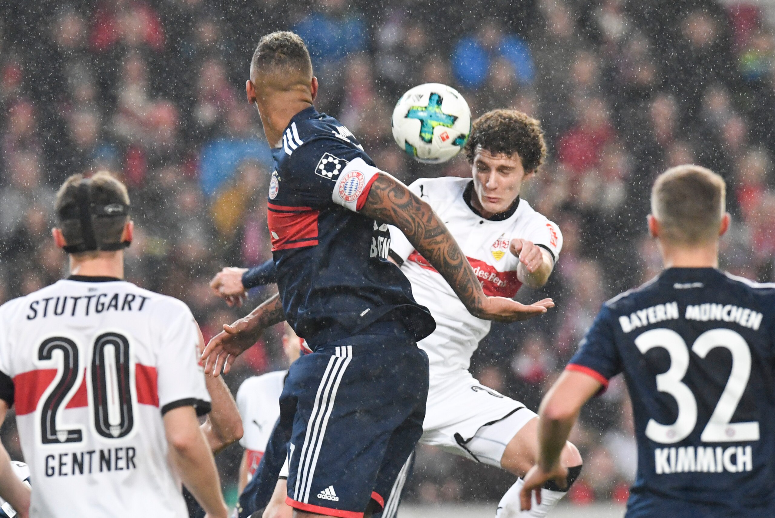 Stuttgart's French defender Benjamin Pavard (R) and Bayern Munich's defender Jerome Boateng vie for the ball during the German first division Bundesliga football match between VfB Stuttgart and Bayern Munich on December 16, 2017 in Stuttgart. / AFP PHOTO 