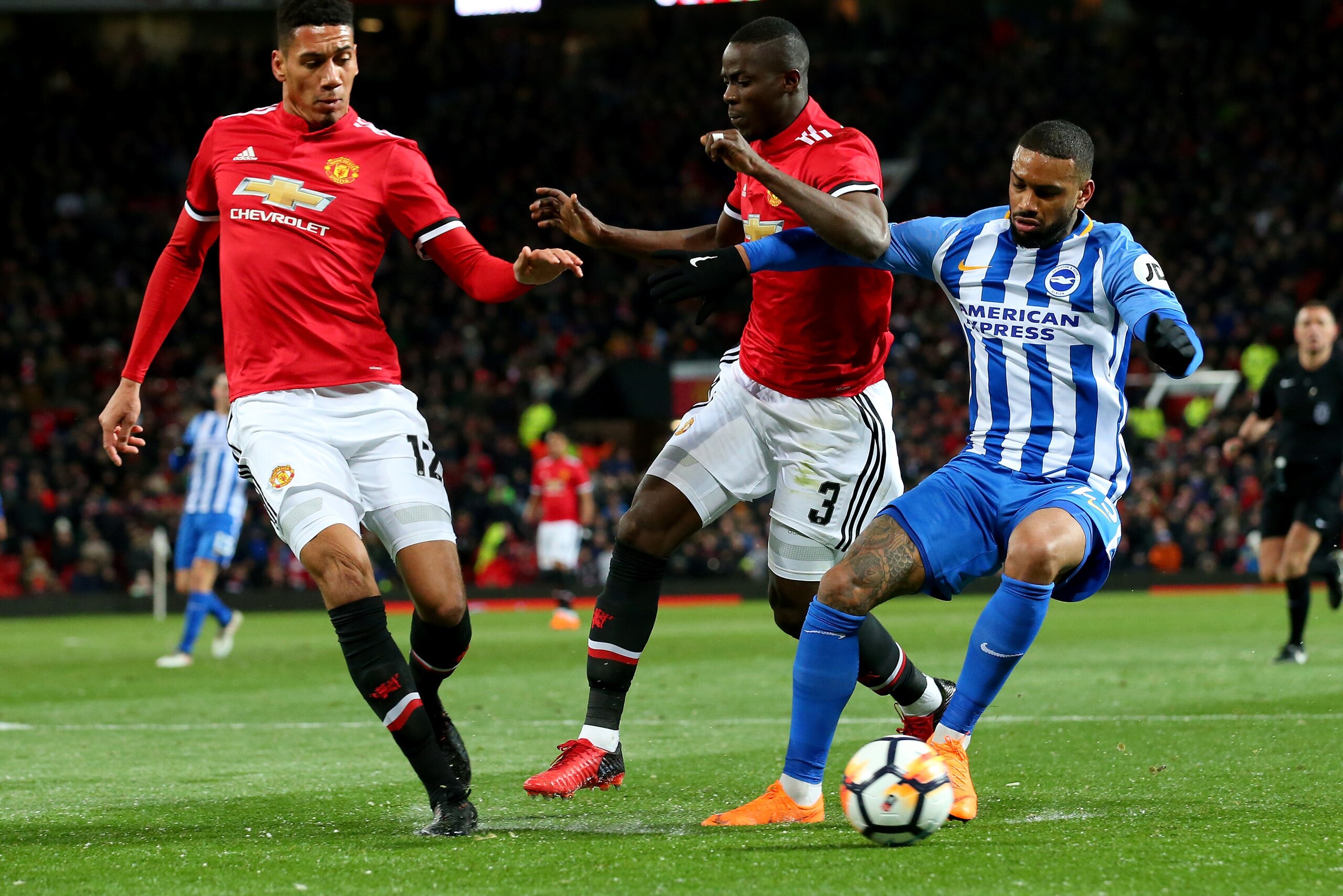 MANCHESTER, ENGLAND - MARCH 17:  Chris Smalling and Eric Bailly of Manchester United challenging Jurgen Locadia of Brighton during the Emirates FA Cup Quarter Final between Manchester United and Brighton & Hove Albion at Old Trafford on March 17, 2018 in 