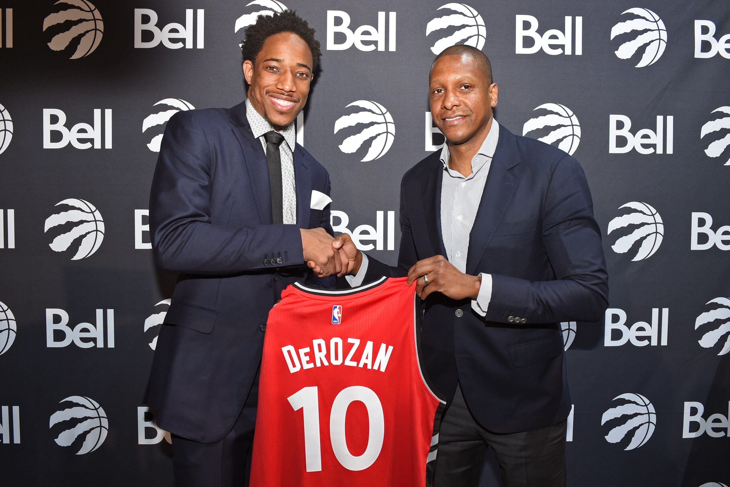 TORONTO, CANADA - JULY 14: DeMar DeRozan #10 and Masai Ujiri of the Toronto Raptors pose for a photo during a press conference after announcing his new deal on July 14, 2016 at the Real Sports Bar & Grill in Toronto, Ontario, Canada. NOTE TO USER: User TORONTO, CANADA - JULY 14: DeMar DeRozan #10 and Masai Ujiri of the Toronto Raptors pose for a photo during a press conference after announcing his new deal on July 14, 2016 at the Real Sports Bar & Grill in Toronto, Ontario, Canada. NOTE TO USER: User
