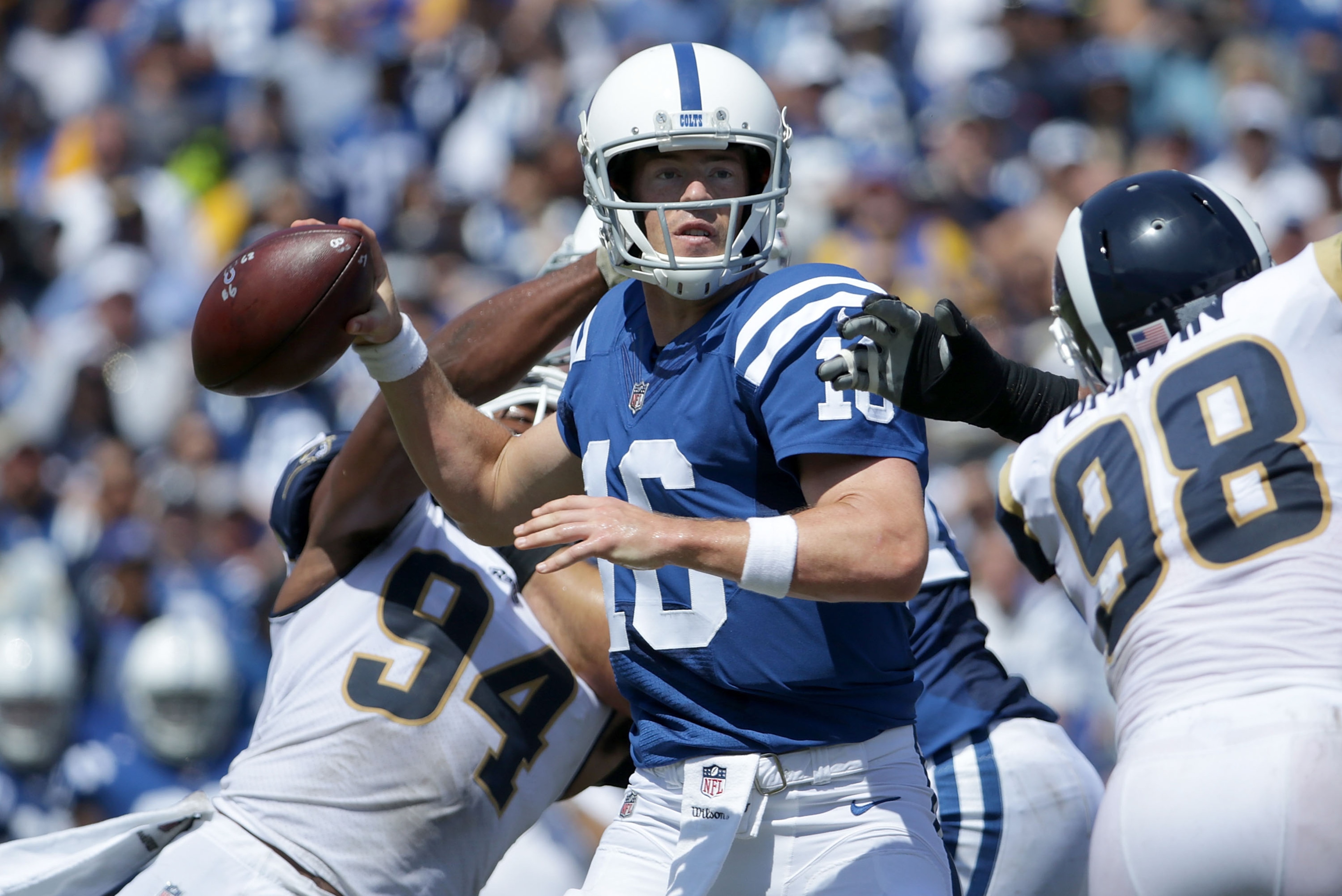 LOS ANGELES, CA - SEPTEMBER 10:  Quarterback Scott Tolzien #16 of the Indianapolis Colts looks for an open receiver against the Los Angeles Rams in the first quarter at Los Angeles Memorial Coliseum on September 10, 2017 in Los Angeles, California. The Ra