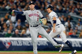 NEW YORK, NY - OCTOBER 16:  (NEW YORK DAILIES OUT)   Alex Bregman #2 of the Houston Astros in action against Aaron Judge #99 of the New York Yankees in Game Three of the American League Championship Series at Yankee Stadium on October 16, 2017 in the Bron