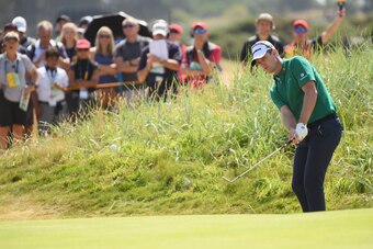 CARNOUSTIE, SCOTLAND - JULY 19:  Justin Rose of England chips out of the rough on the 11th green during the first round of the 147th Open Championship at Carnoustie Golf Club on July 19, 2018 in Carnoustie, Scotland.  (Photo by Harry How/Getty Images)